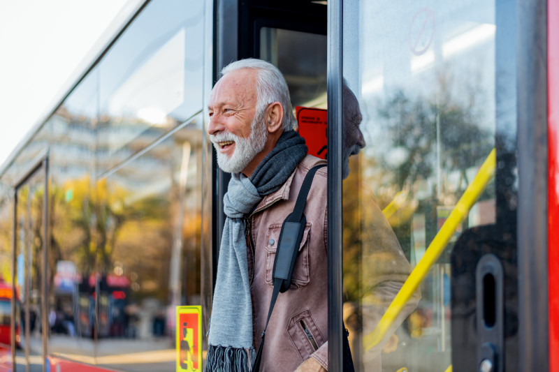 Senior Business Man Using Public Transportation 