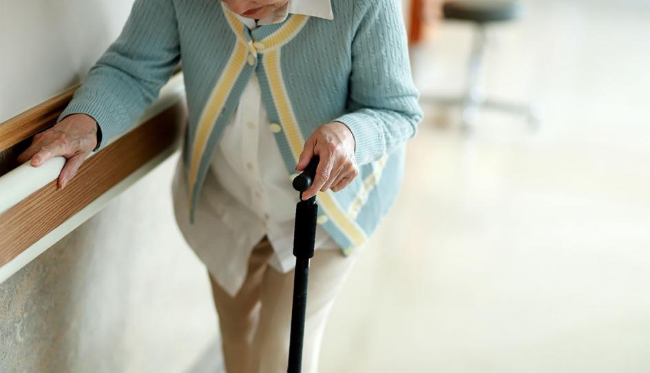 1140-woman-walking-nursing-home.jpg
