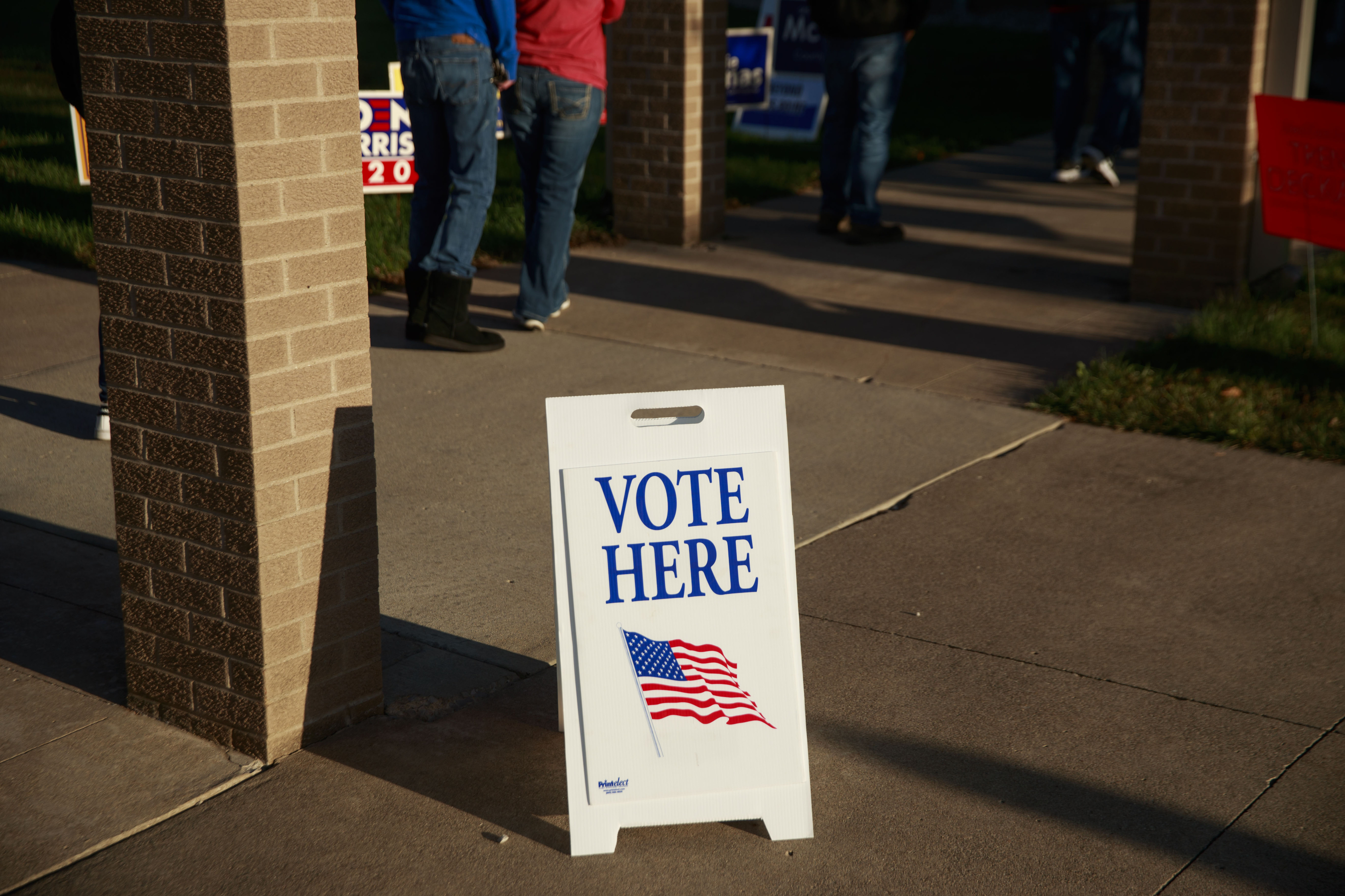 ELLETTSVILLE, INDIANA, UNITED STATES - 2020/11/03: A "Vote here" sign seen on Election Day 2020 at St. John the Apostle Catholic Church in Ellettsville, Indiana