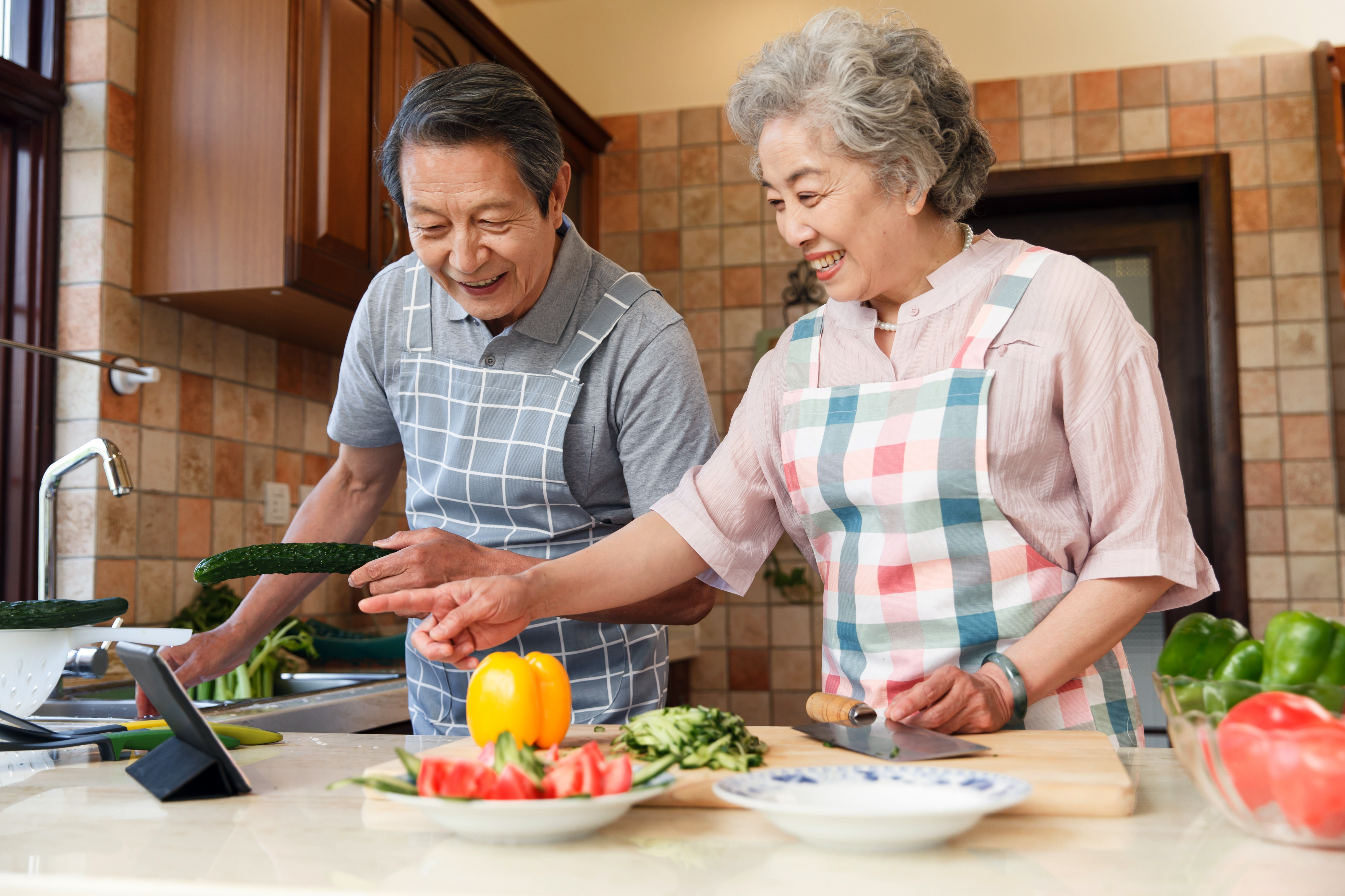 The old couple are in the kitchen