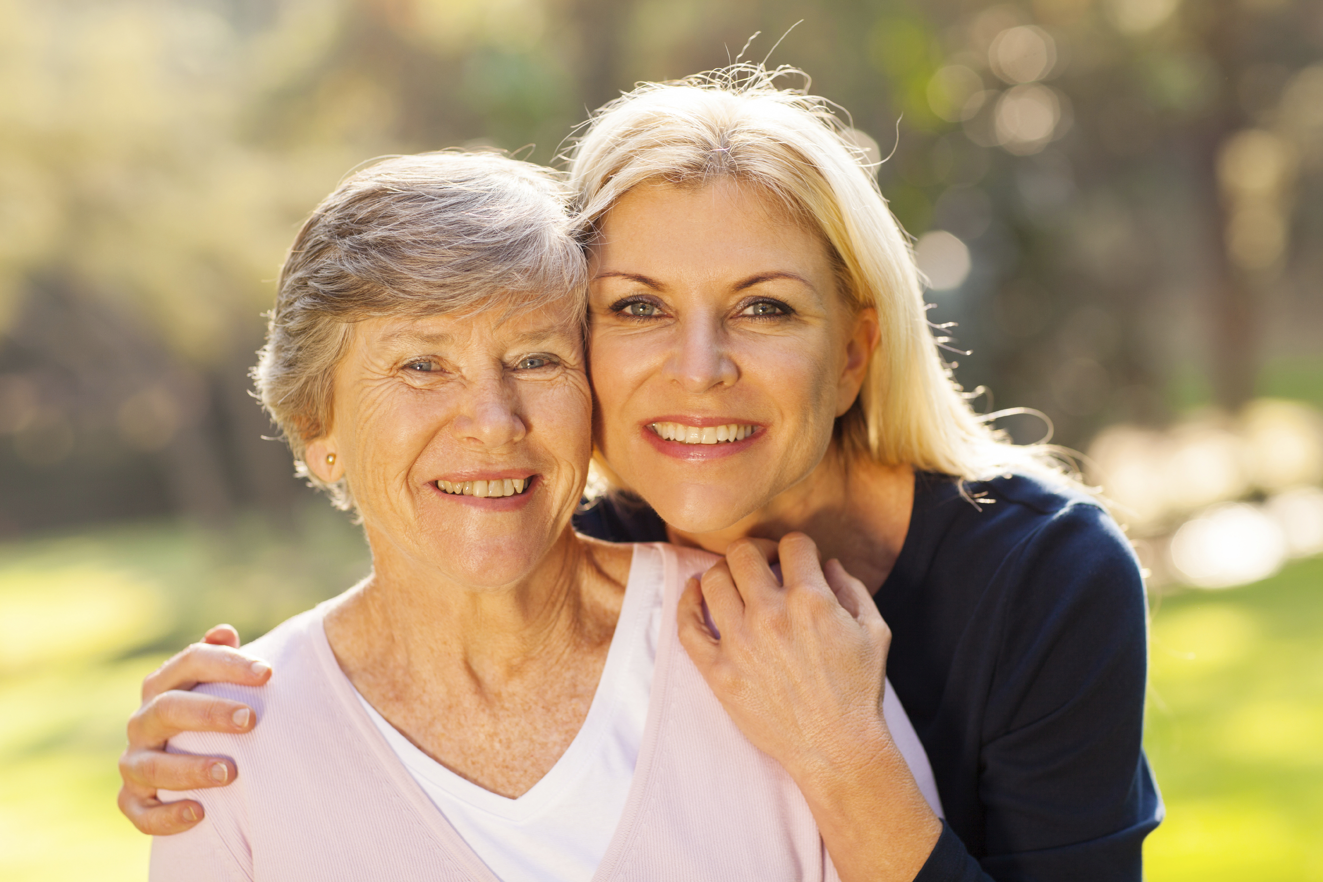 senior woman and middle aged daughter