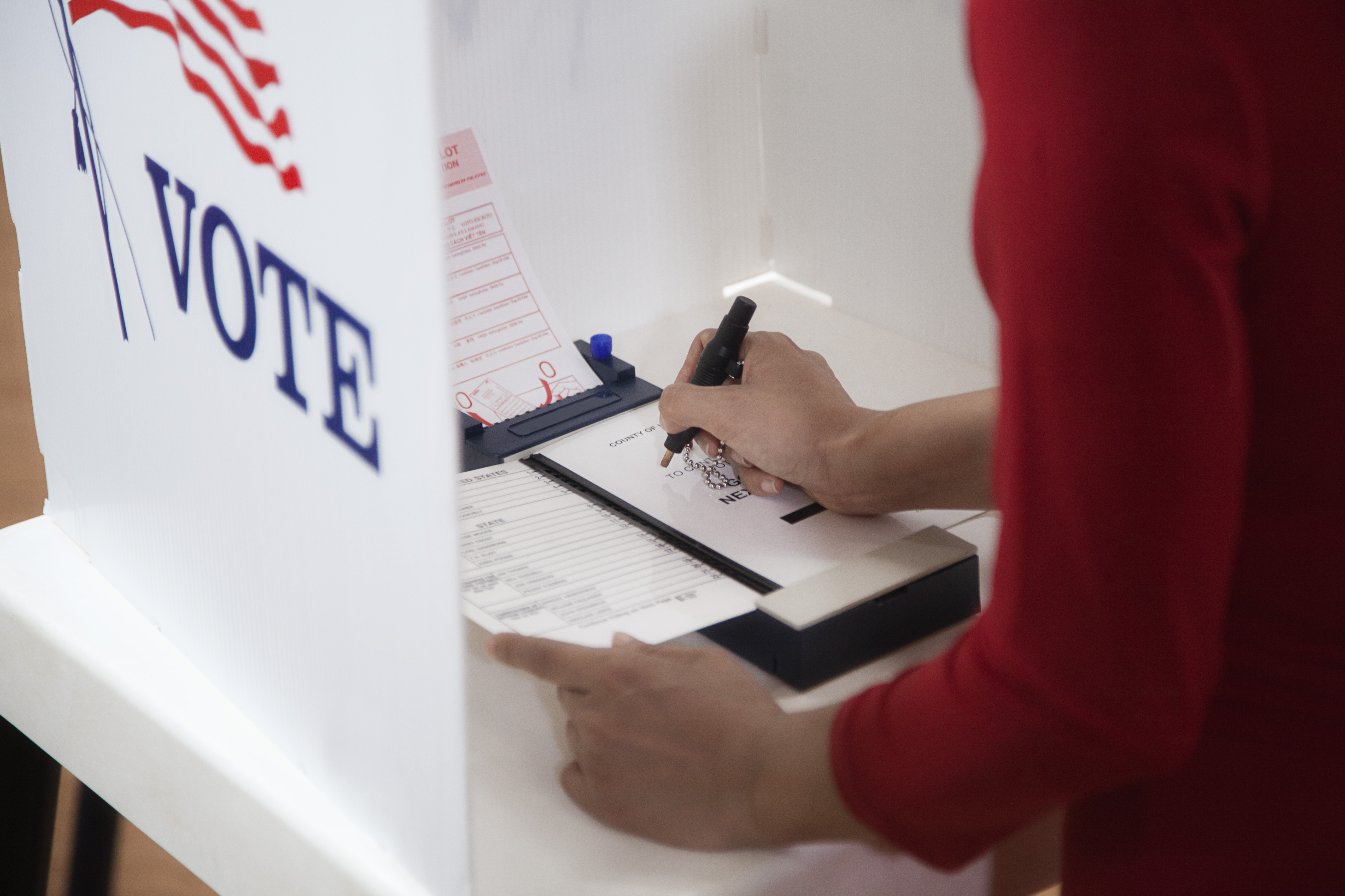 Voter voting in polling place
