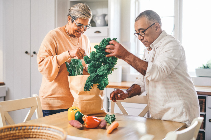 Shot of a senior couple cooking in the kitchen at home