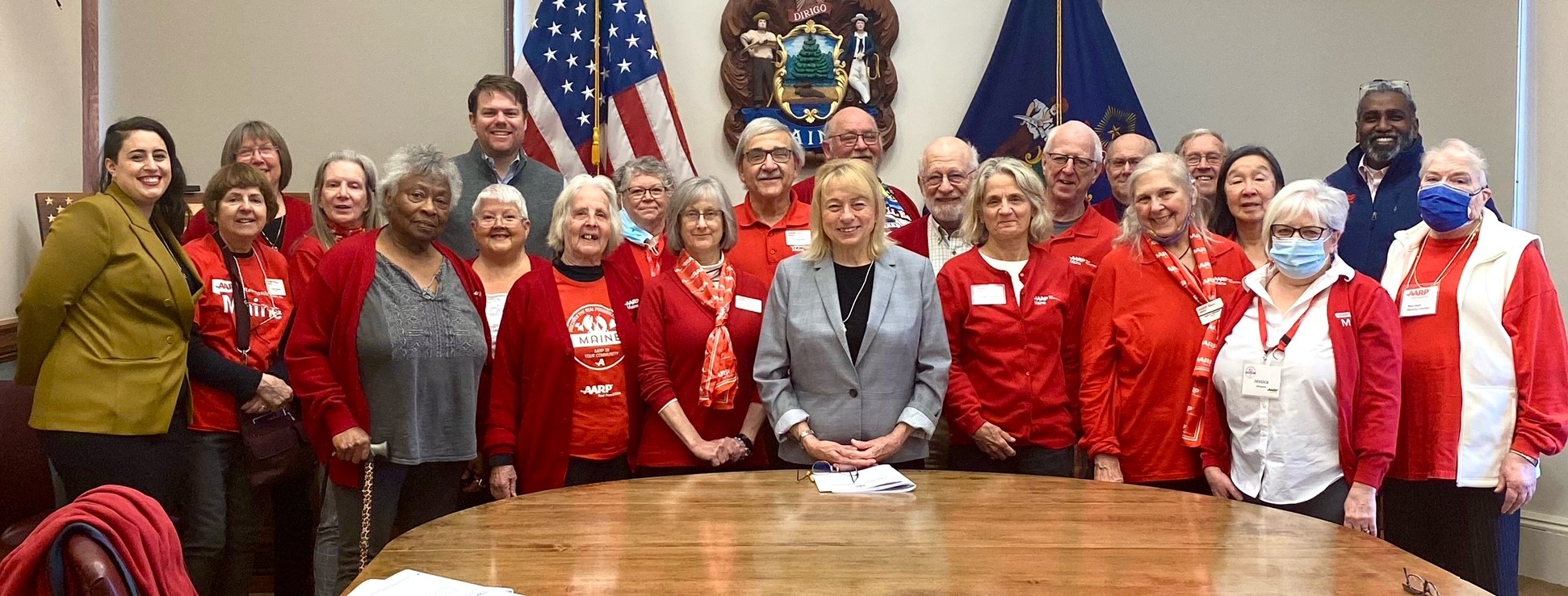 AARP Maine volunteers and staff members with Governor Mills at the State House, April 2022