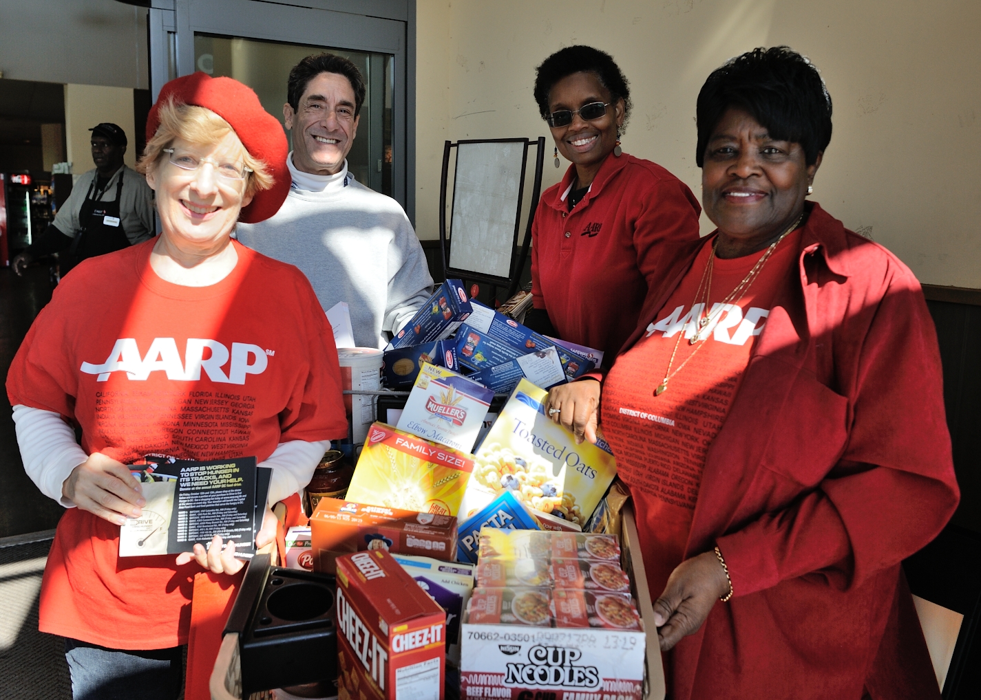 AARP DC volunteers collecting food for the needy at local grocery stores