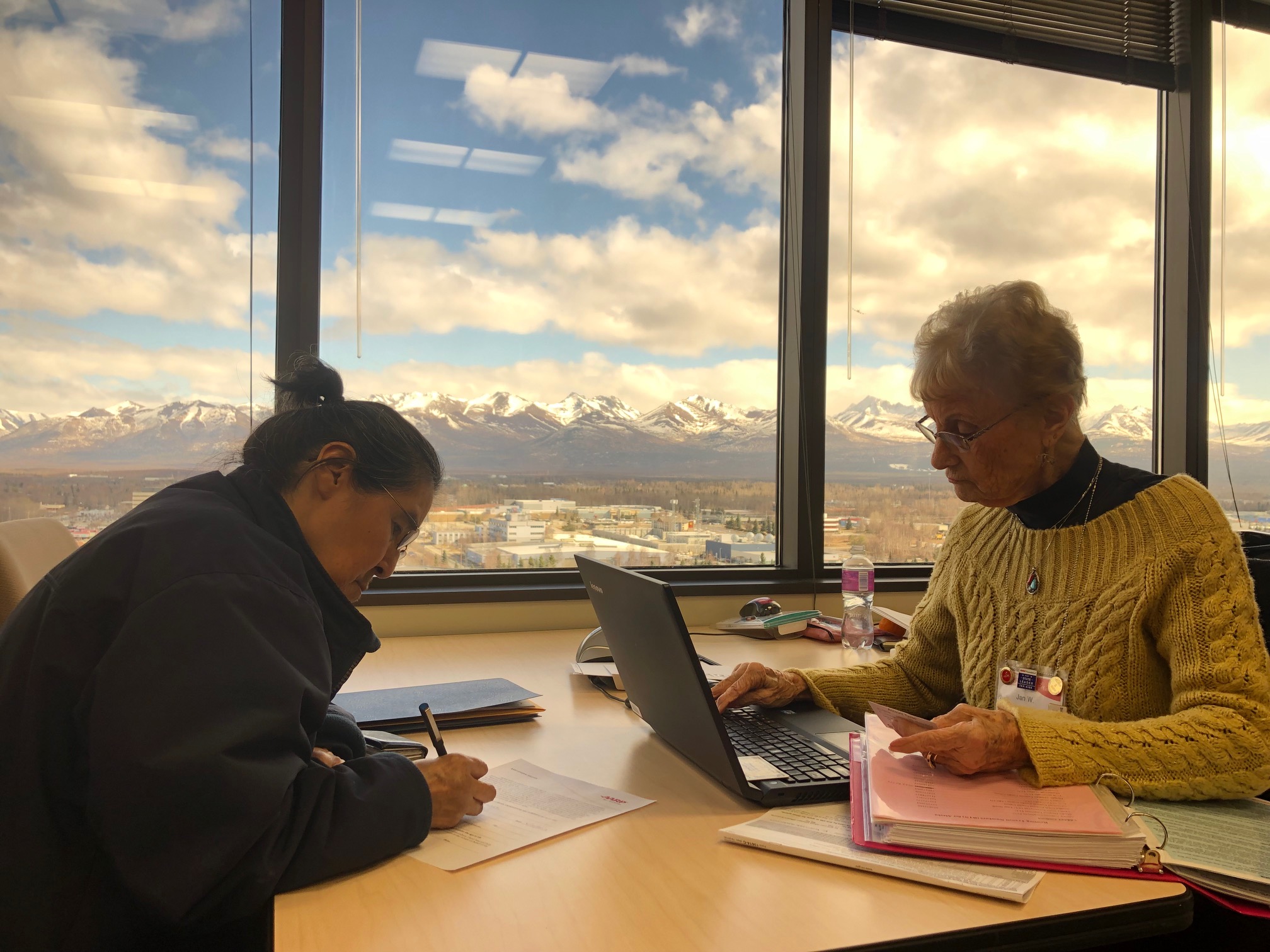 Alaska Tax-Aide volunteer helps a client