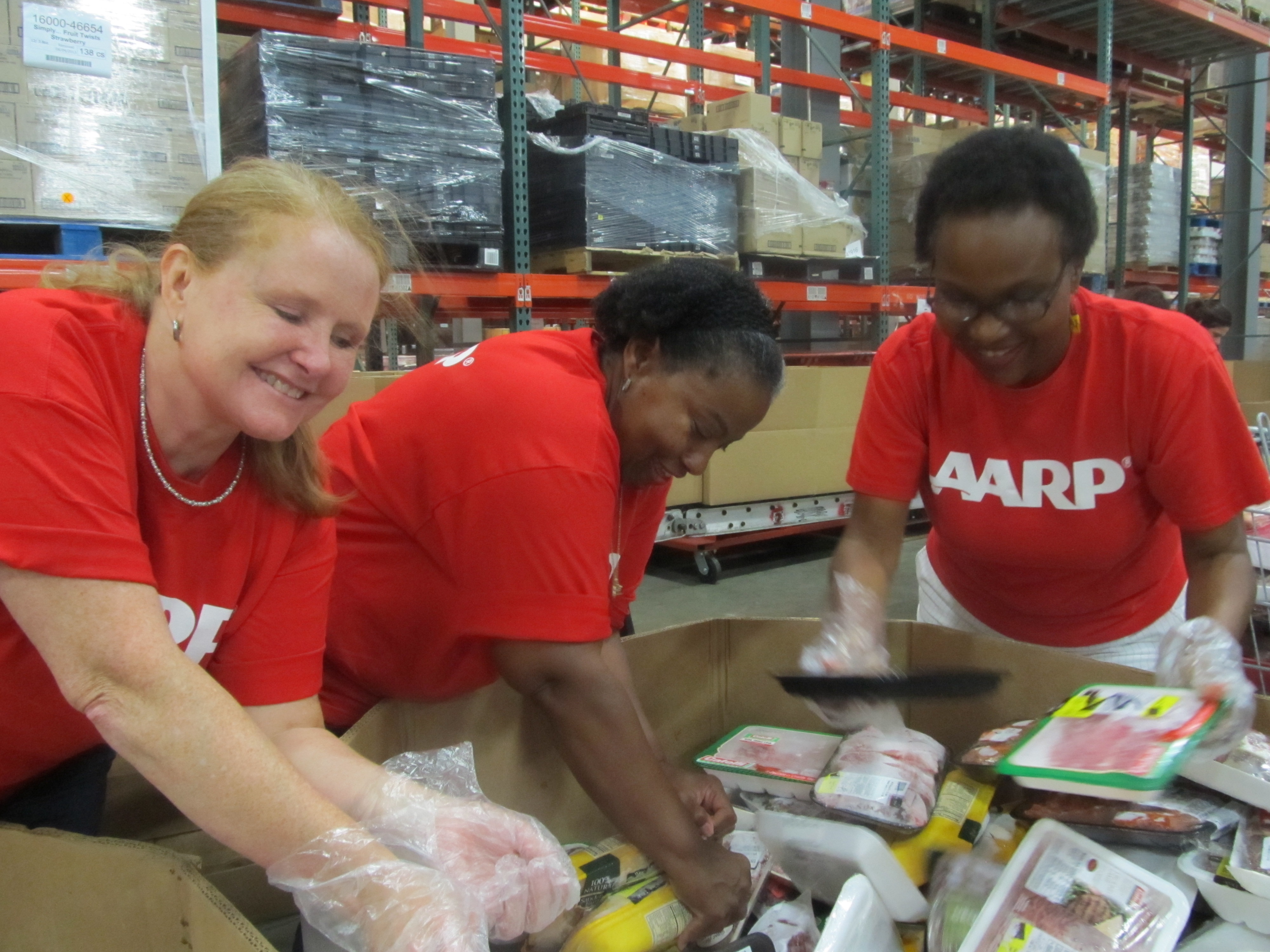 AARP volunteers food bank - showing diversity close-up