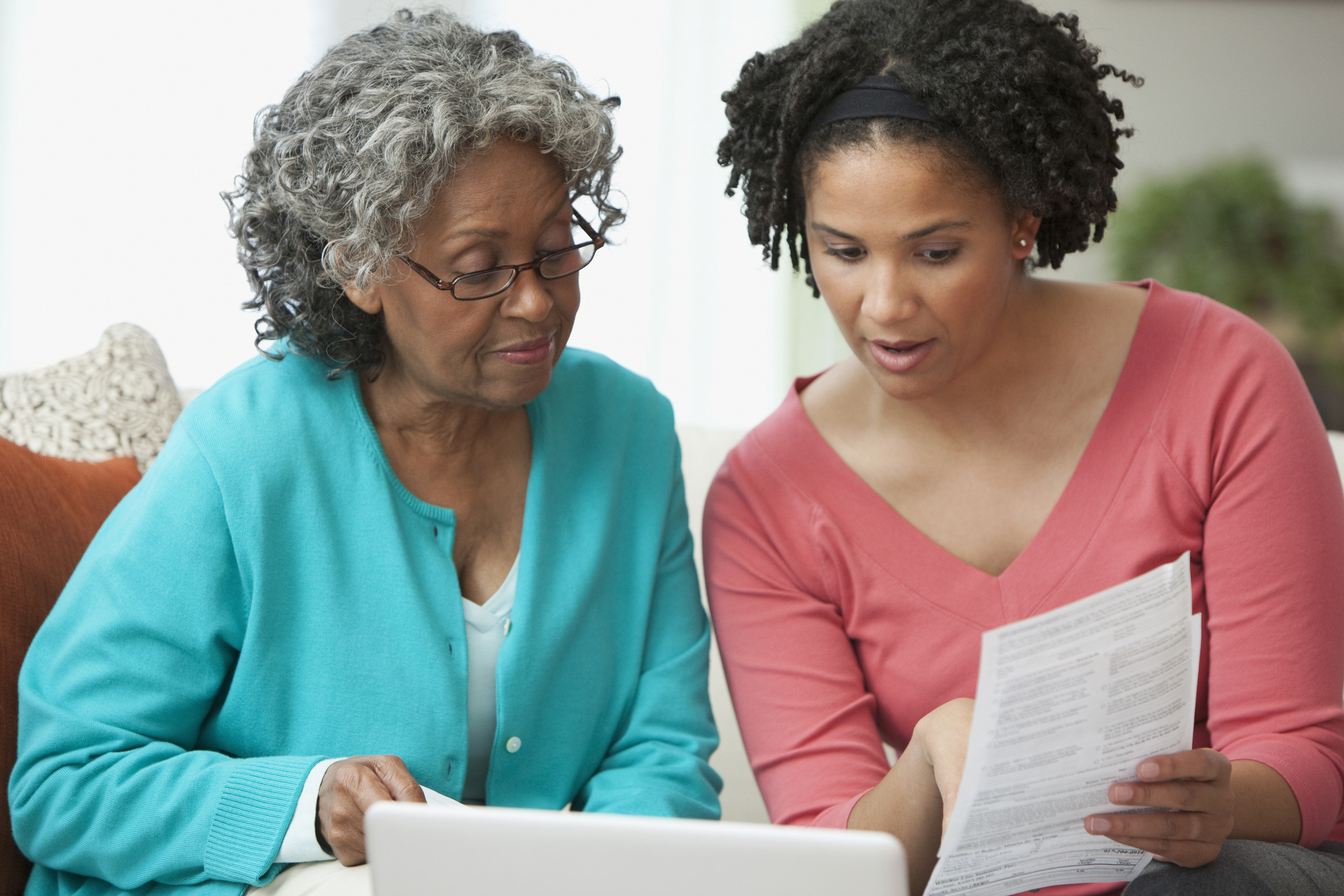 African women looking at paperwork