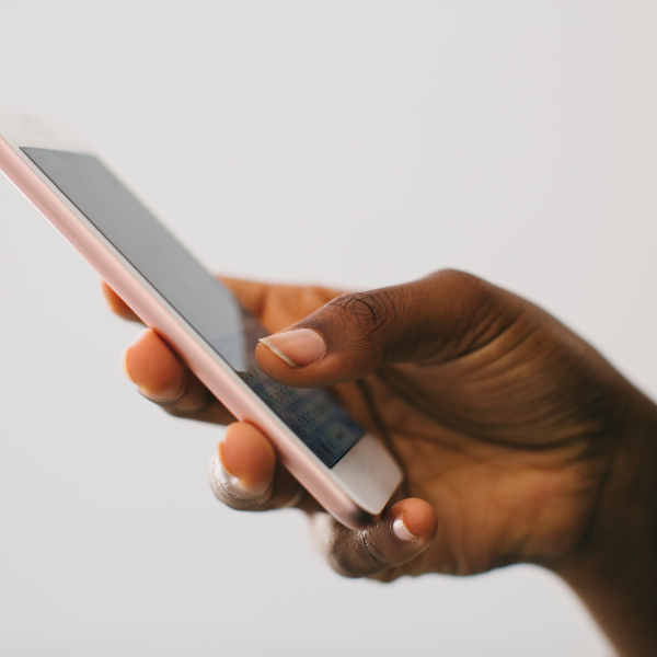 Photo of a person holding a phone 