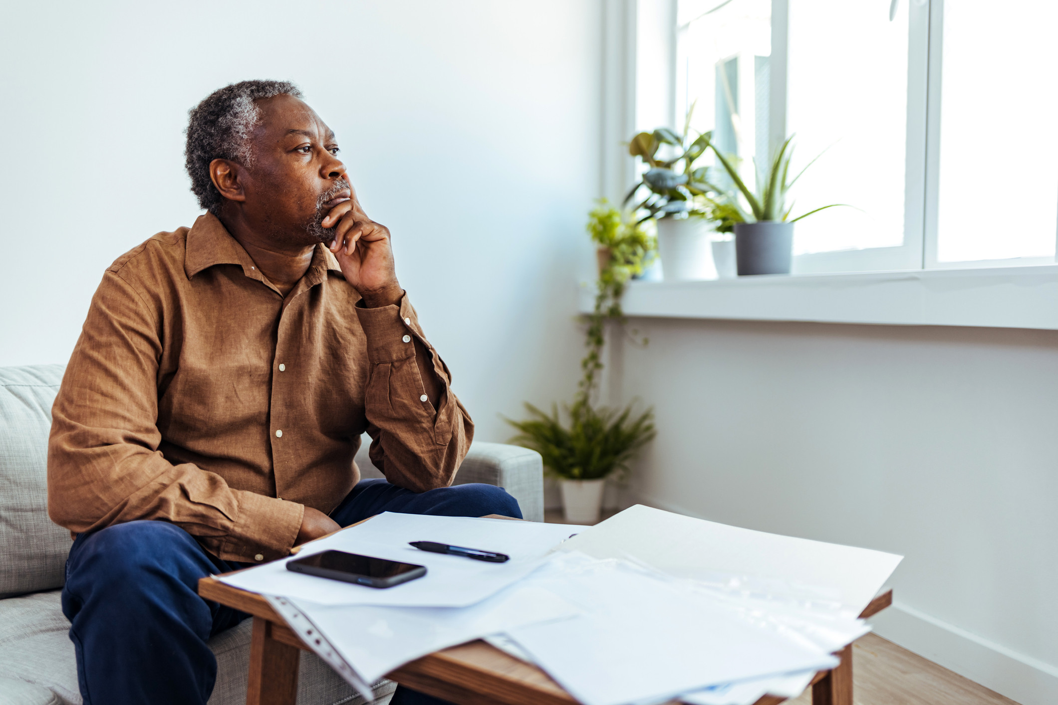 Man looking out of window