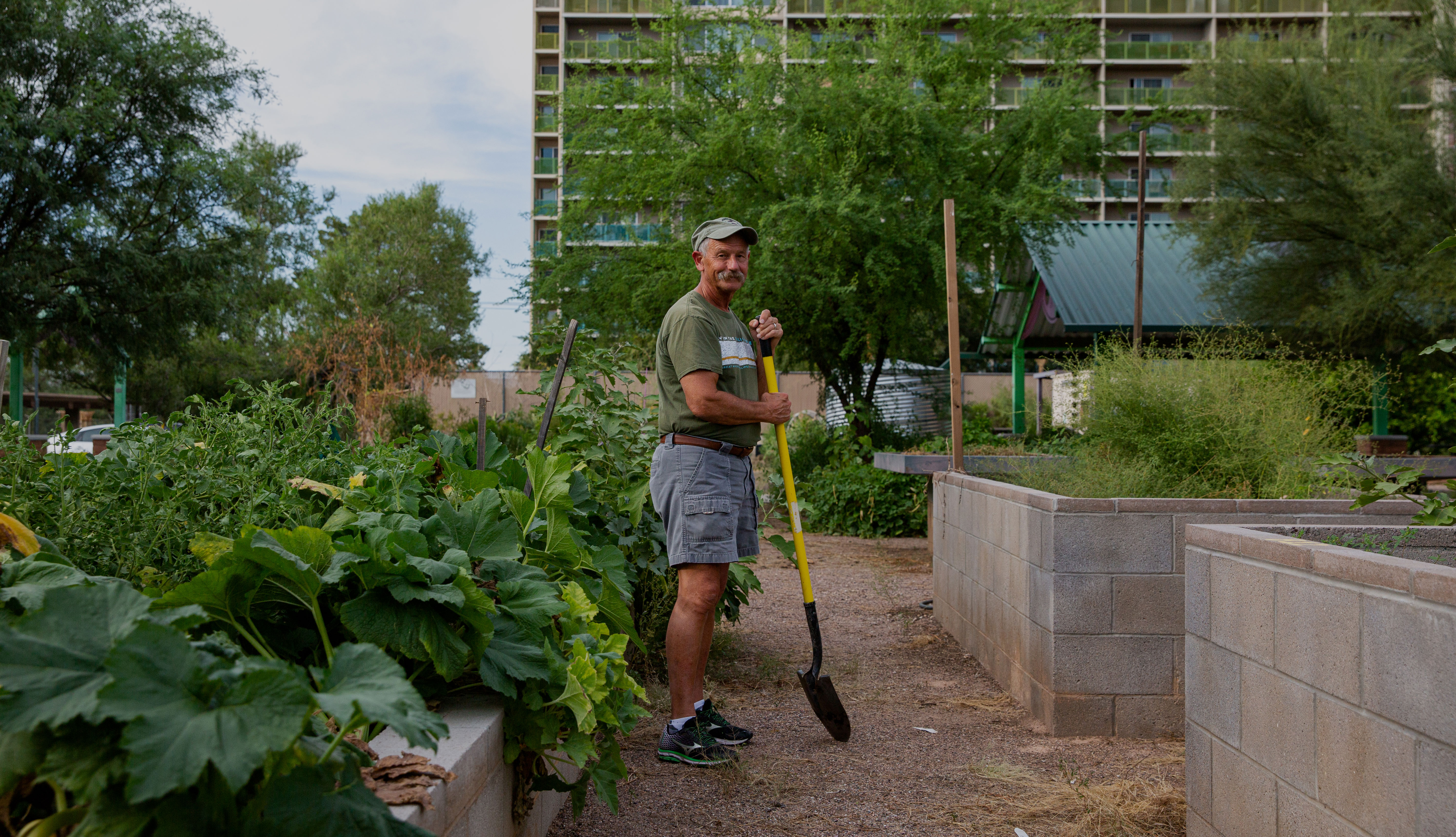 A man working in a community garden
