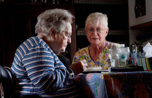 WINDSOR, ME - APRIL 9:  Nancy Boily, 65, a personal care attendant, sits with Mildred Rood, 85, as Rood eats lunch during a recent home care visit to Rood's Windsor home Wednesday, April 9, 2014. Rood, 85, is homebound and largely confined to a wheelchair as a result of advanced diabetes, congestive heart failure and kidney disease.(Photo by Shawn Patrick Ouellette/Staff Photographer)