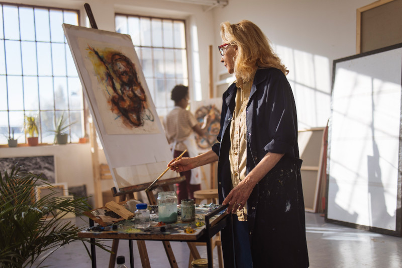 Two women are painting