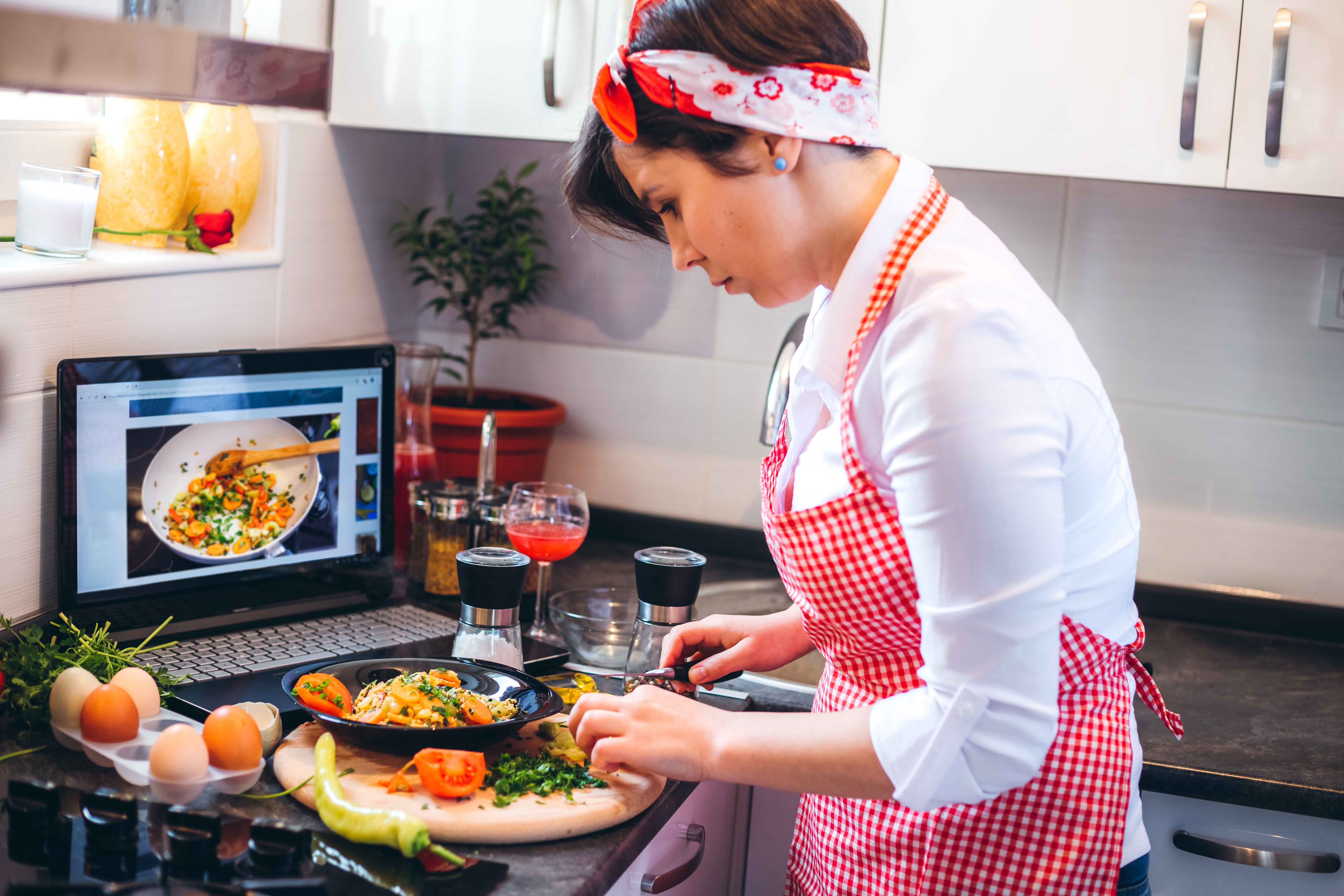 Woman making meal with tutorial