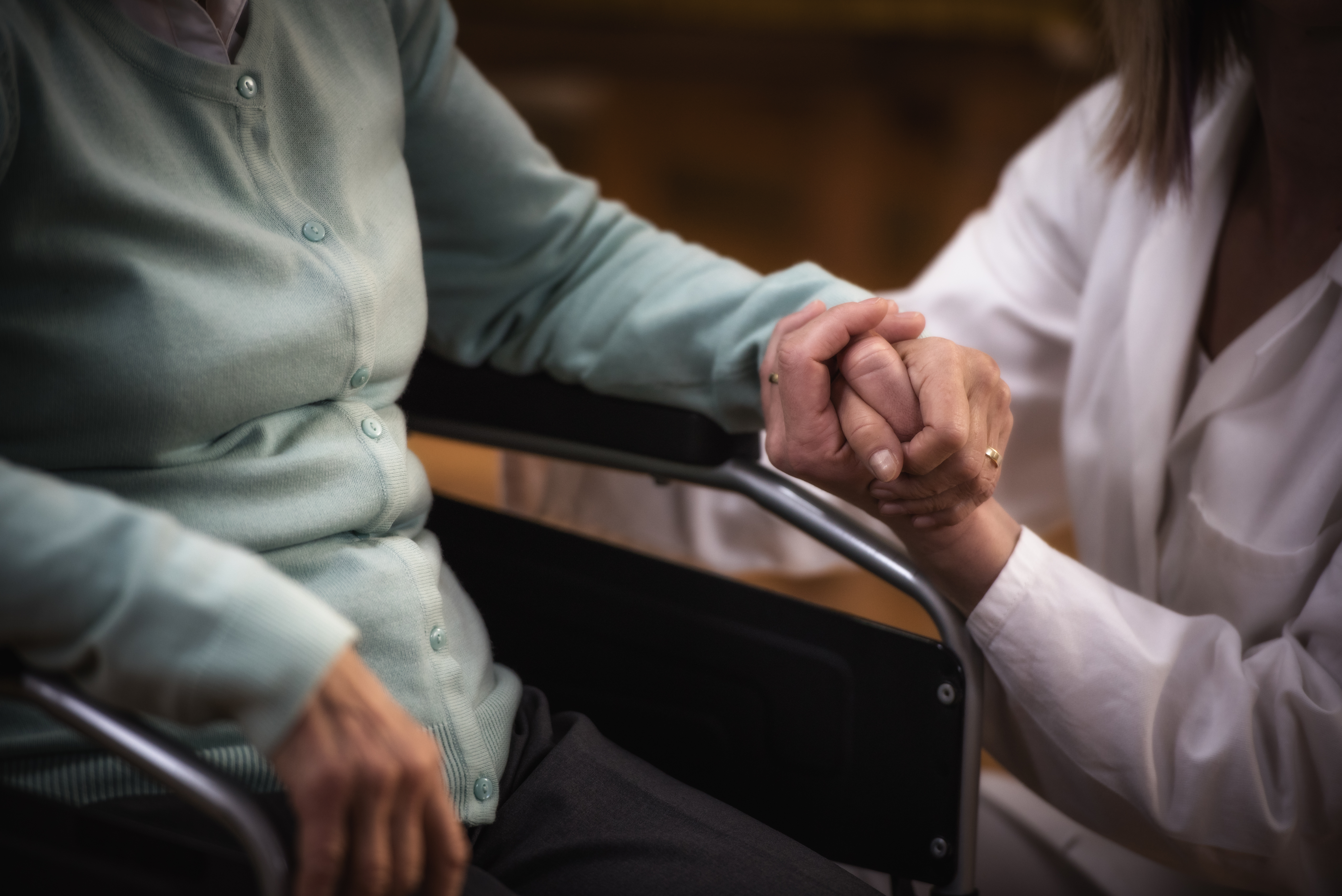 Nurse during home visit with senior woman