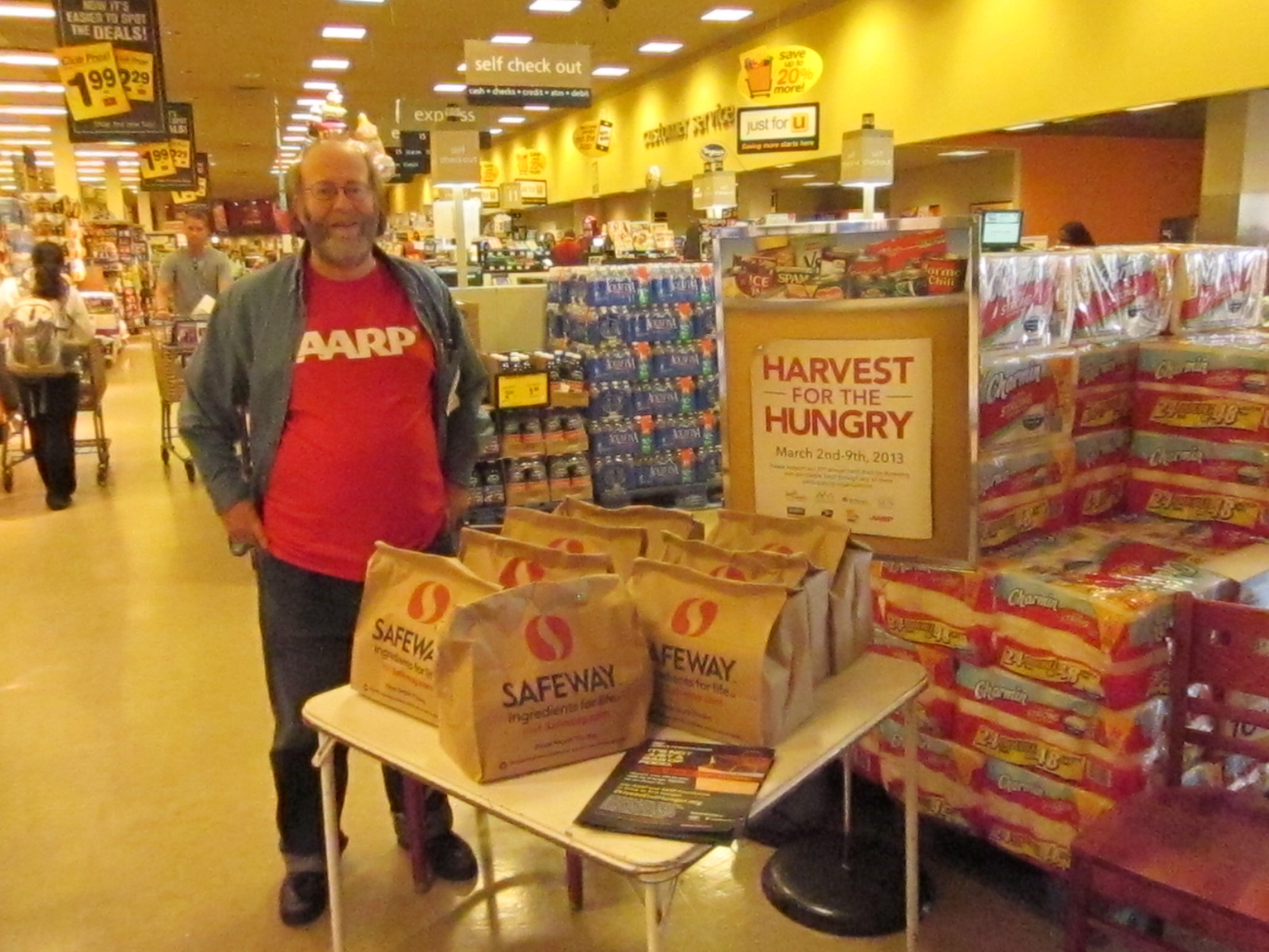 AARP Maryland volunteer Ed Yalow donates his time to encourage others to donate food for Harvest for the Hungry in Baltimore.