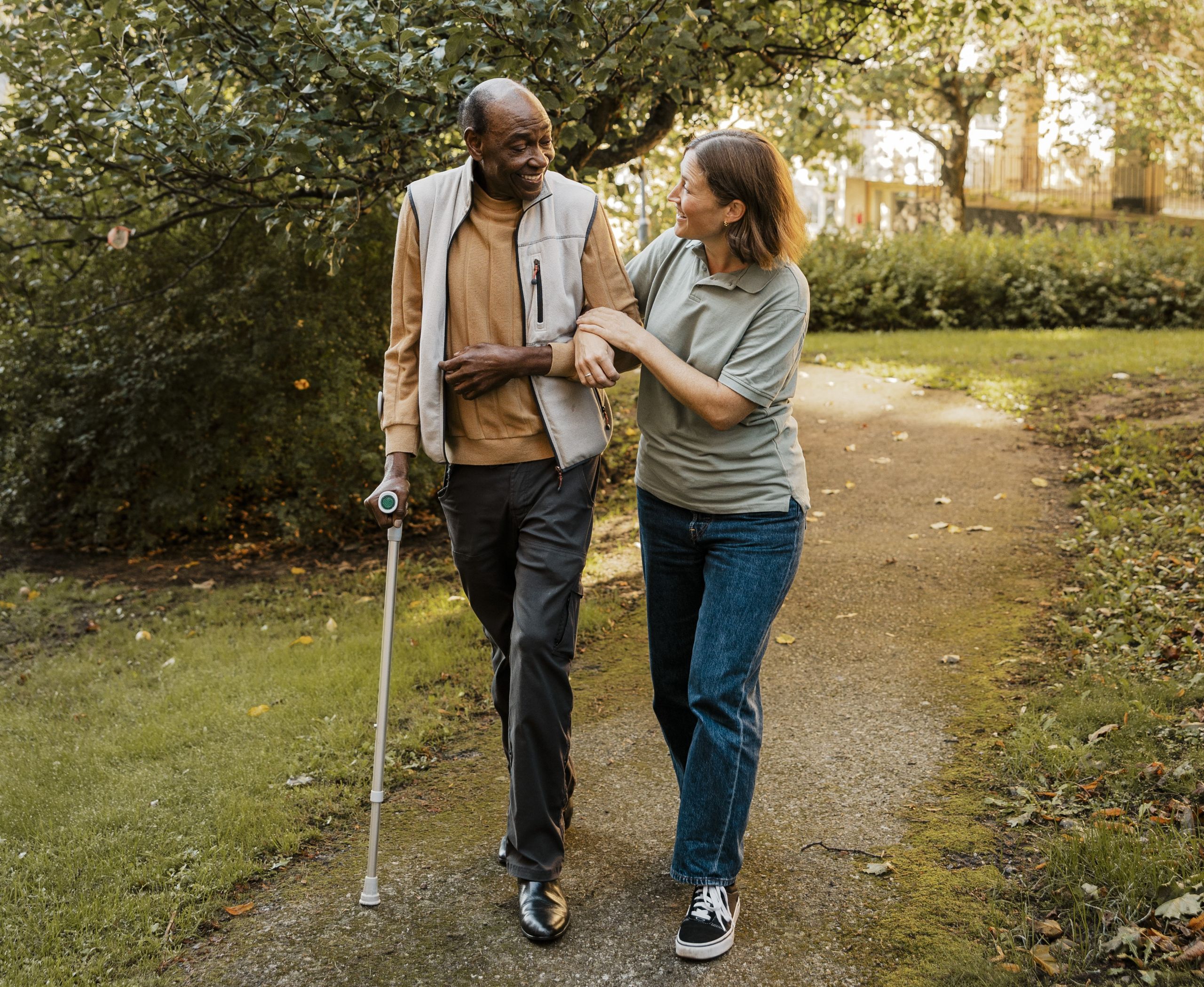 Caretaker goes for a walk with older man