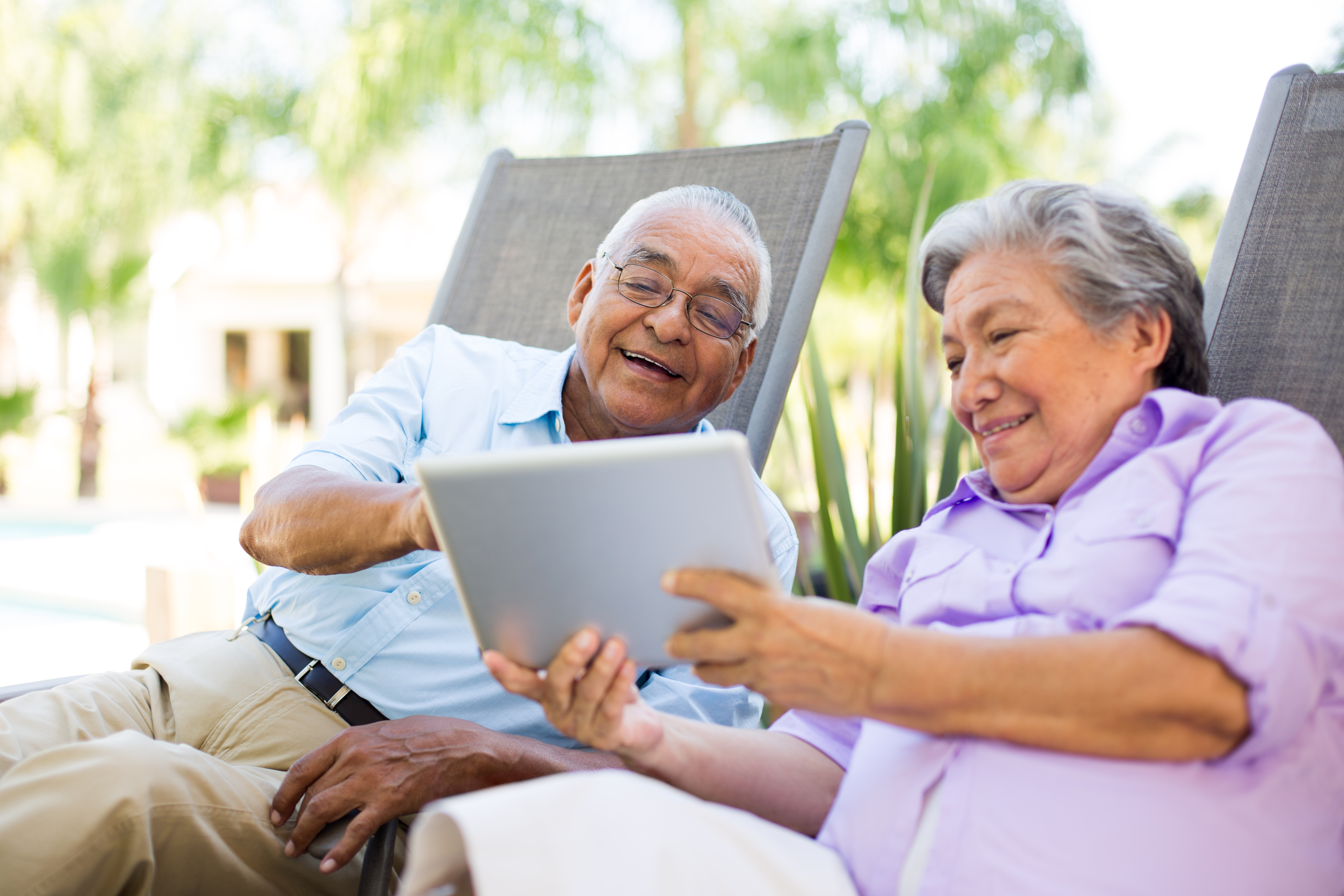 Senior couple looking at a tablet