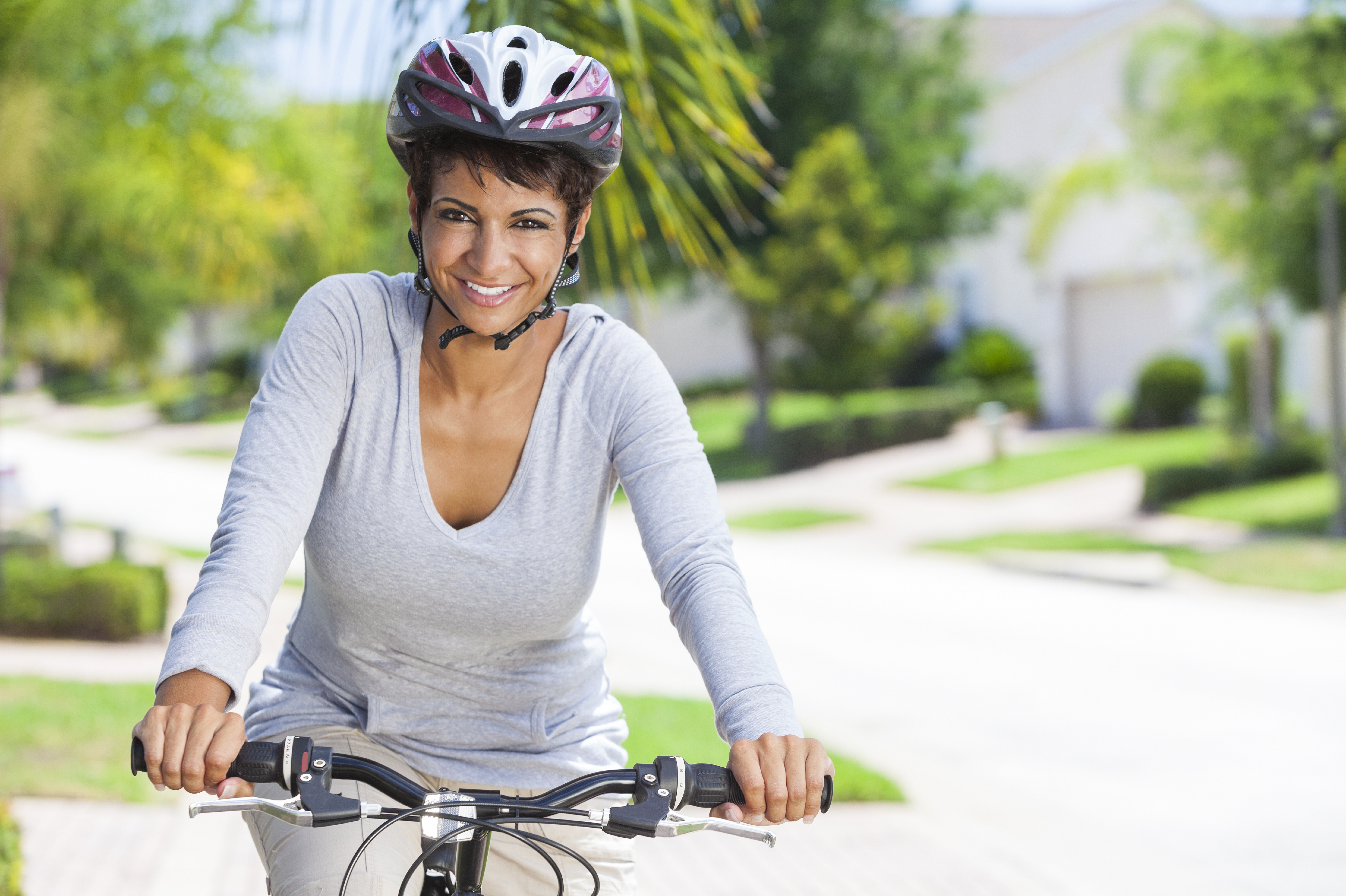 African American Woman Riding Bike