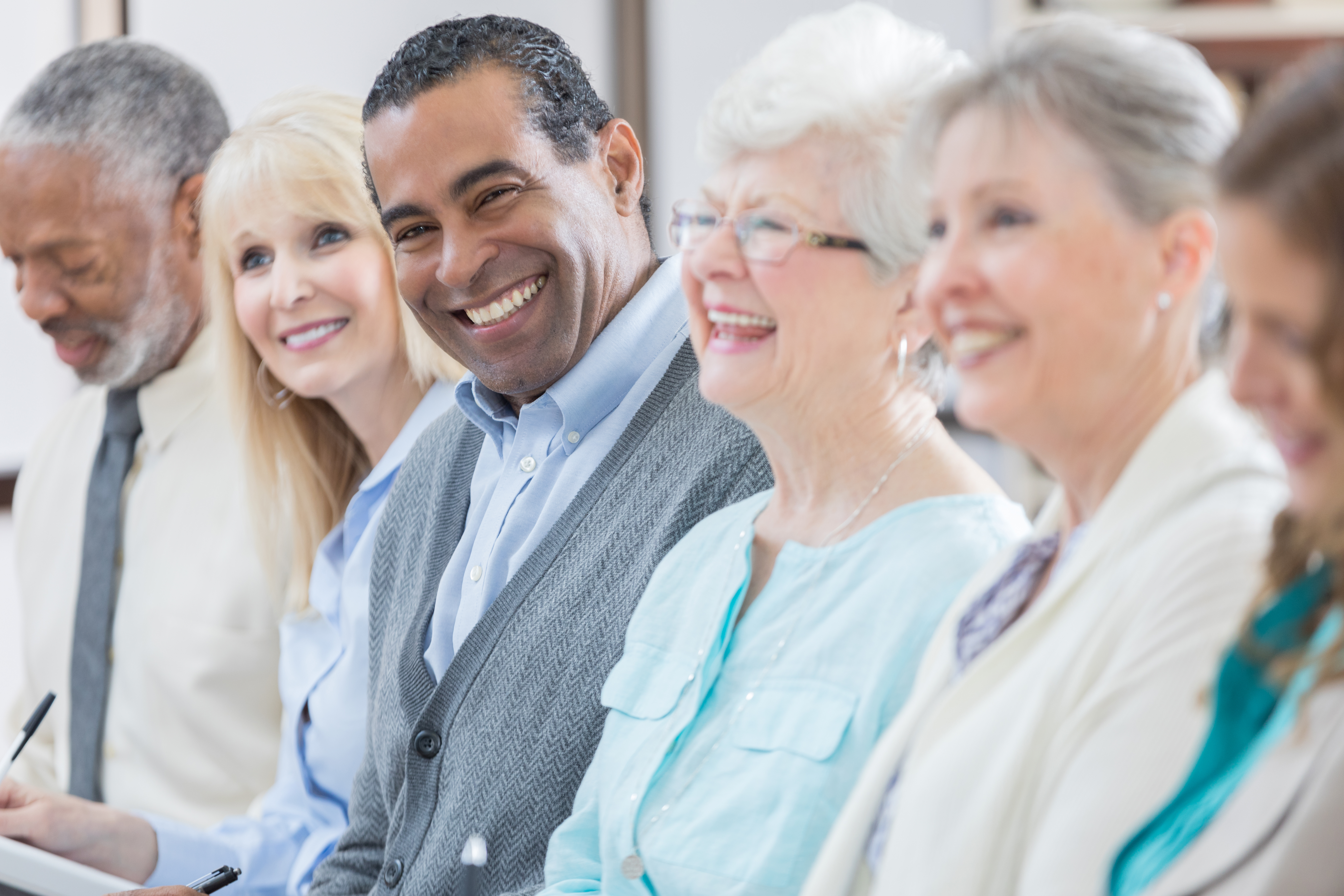 Senior men and women attend seminar at senior center