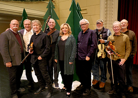 A photo of nine musicians in the fiddlers group