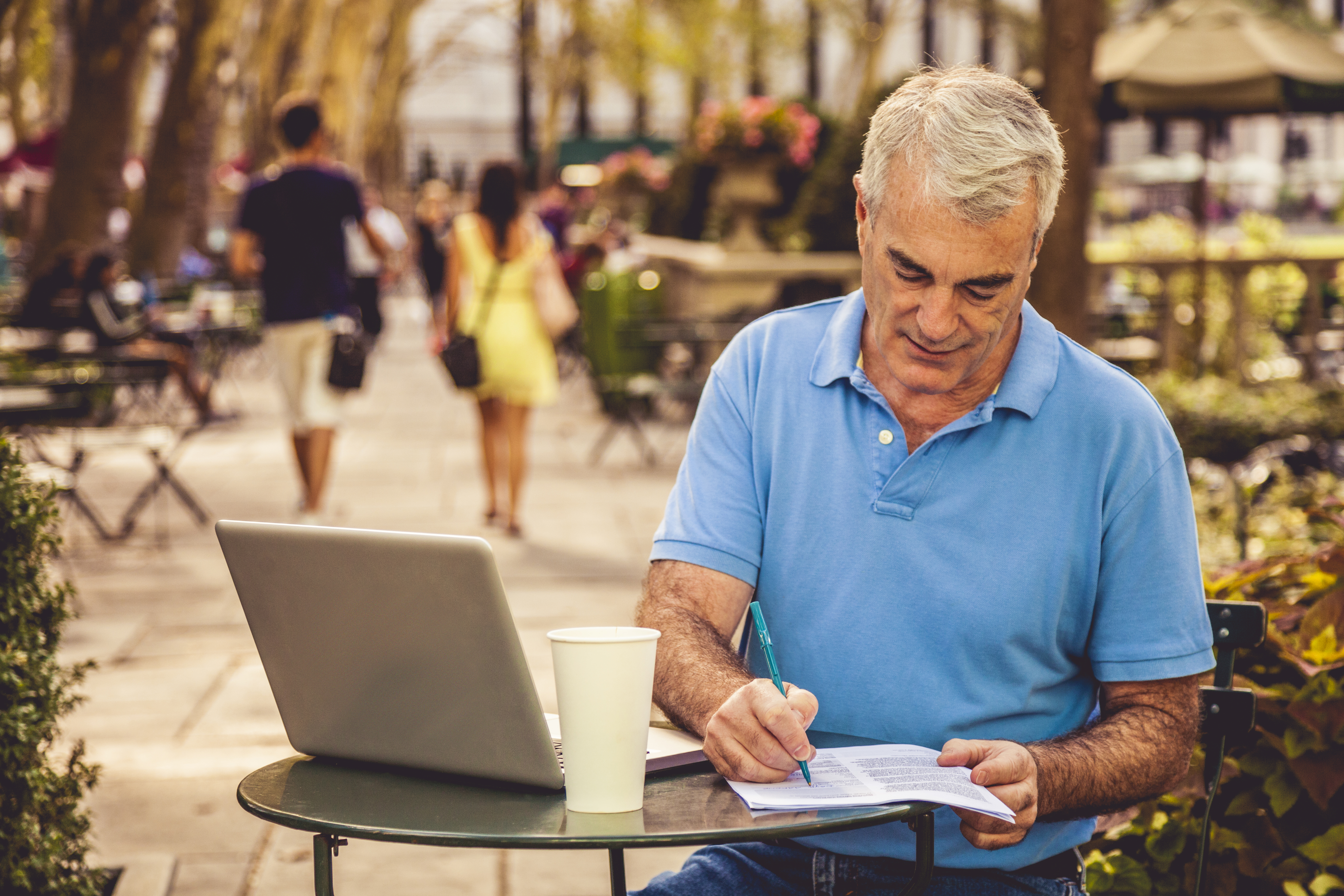 Man filling documents in a public area in New York