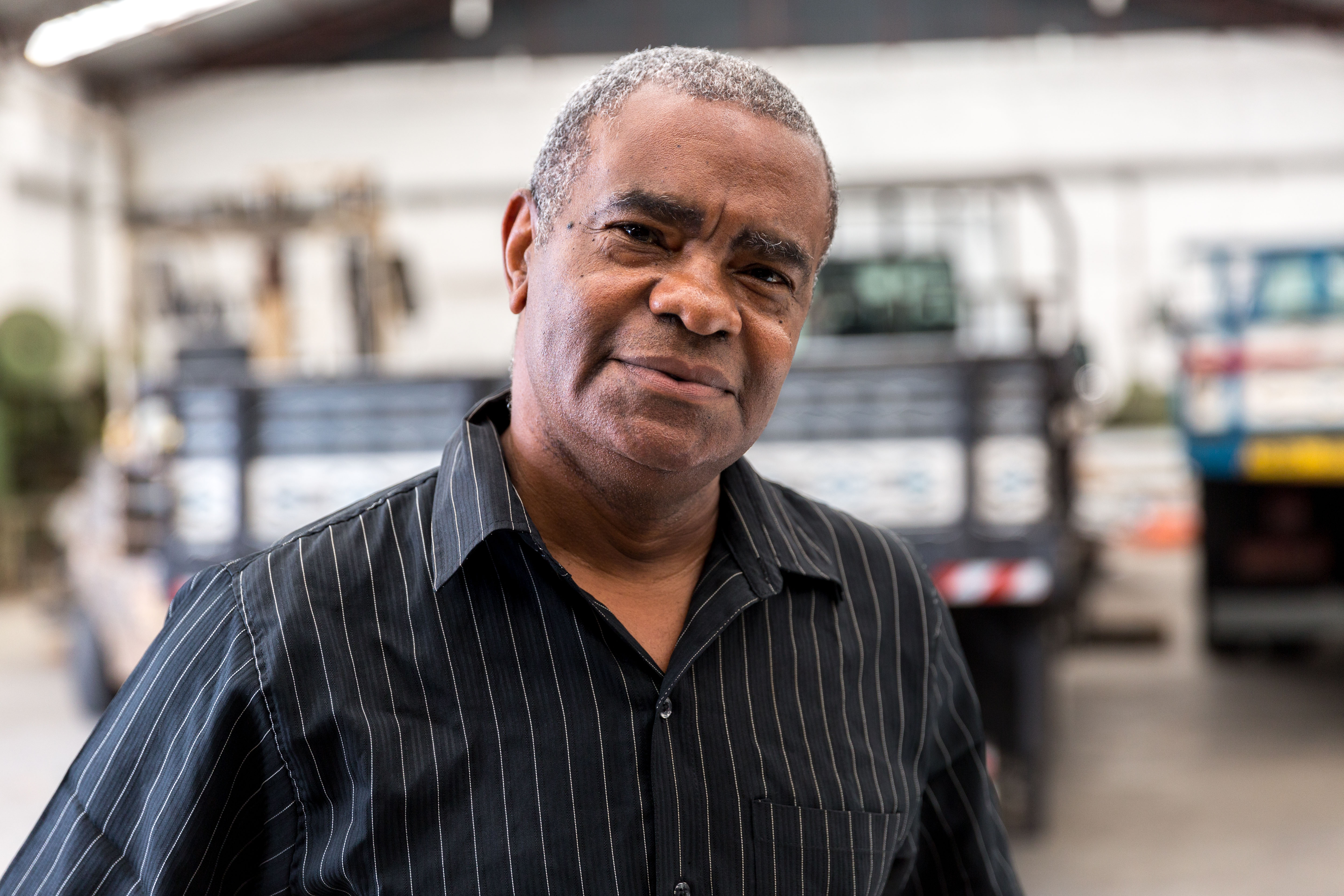 Portrait of Worker on Factory on background