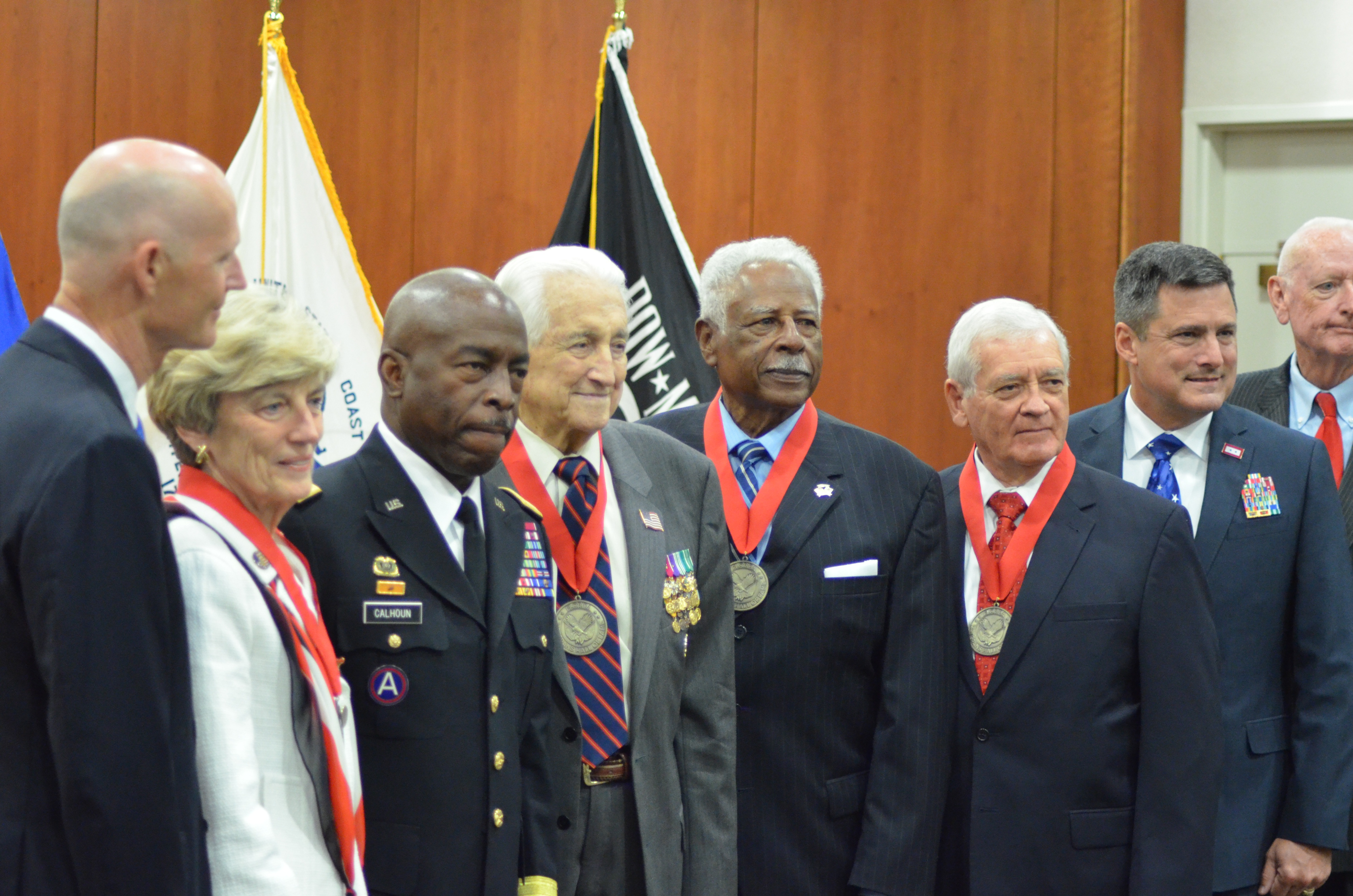 Gov. Rick Scott; Mrs. Jane Sisson Collins, widow of the late Adm. LeRoy Collins Jr.; Florida Adj. Gen. and Maj. Gen. Michael Calhoun; Lt. Gen. Snowden; Chief Master Sgt. Johnson; Col. Farmer; Col. Mike Prendergast, executive director of the Florida Department of Veterans Affairs; and Sgt. Maj. Ray Quinn, chairman of the Florida Veterans Hall of Fame Council.