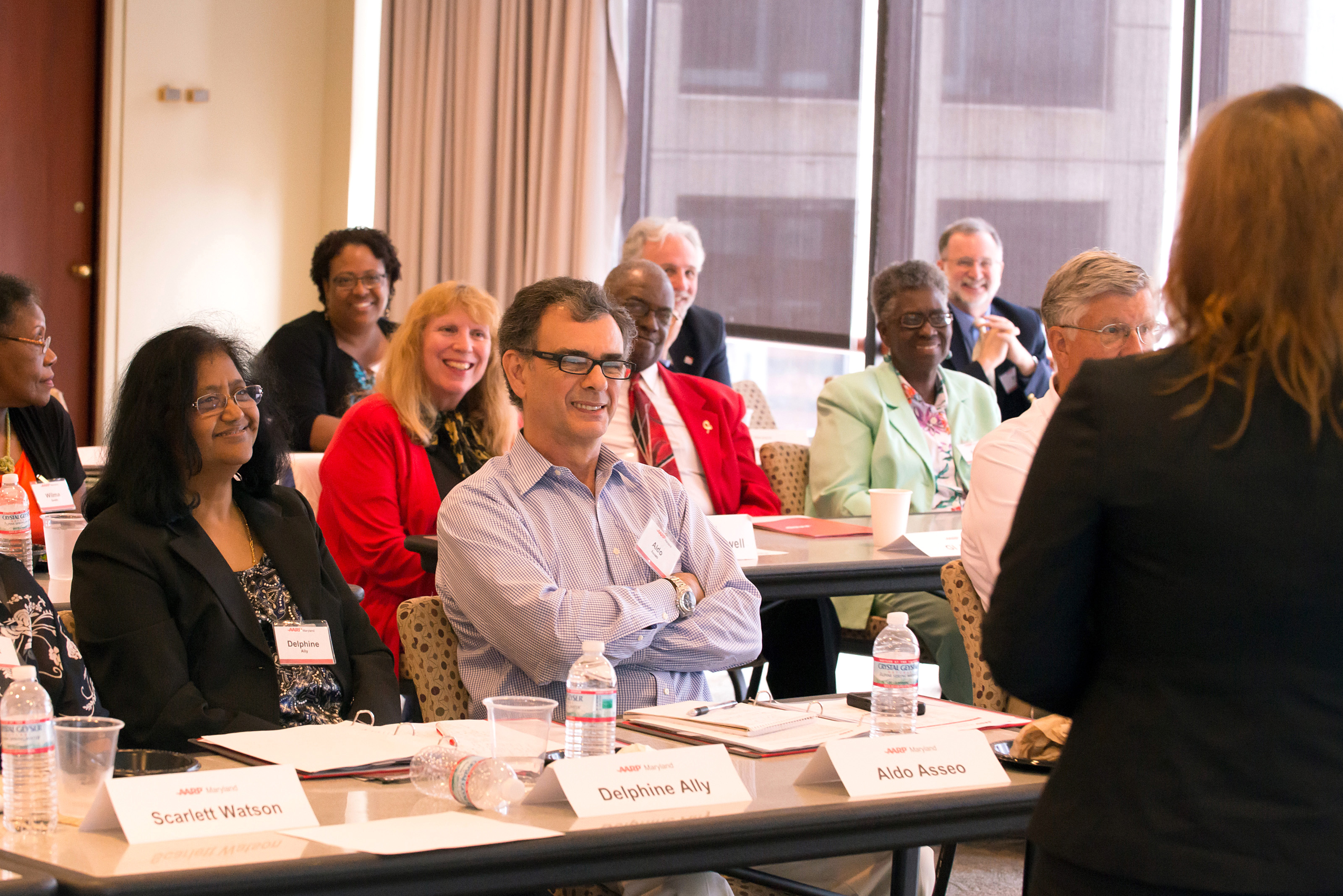 AARP volunteers listen in during a session.