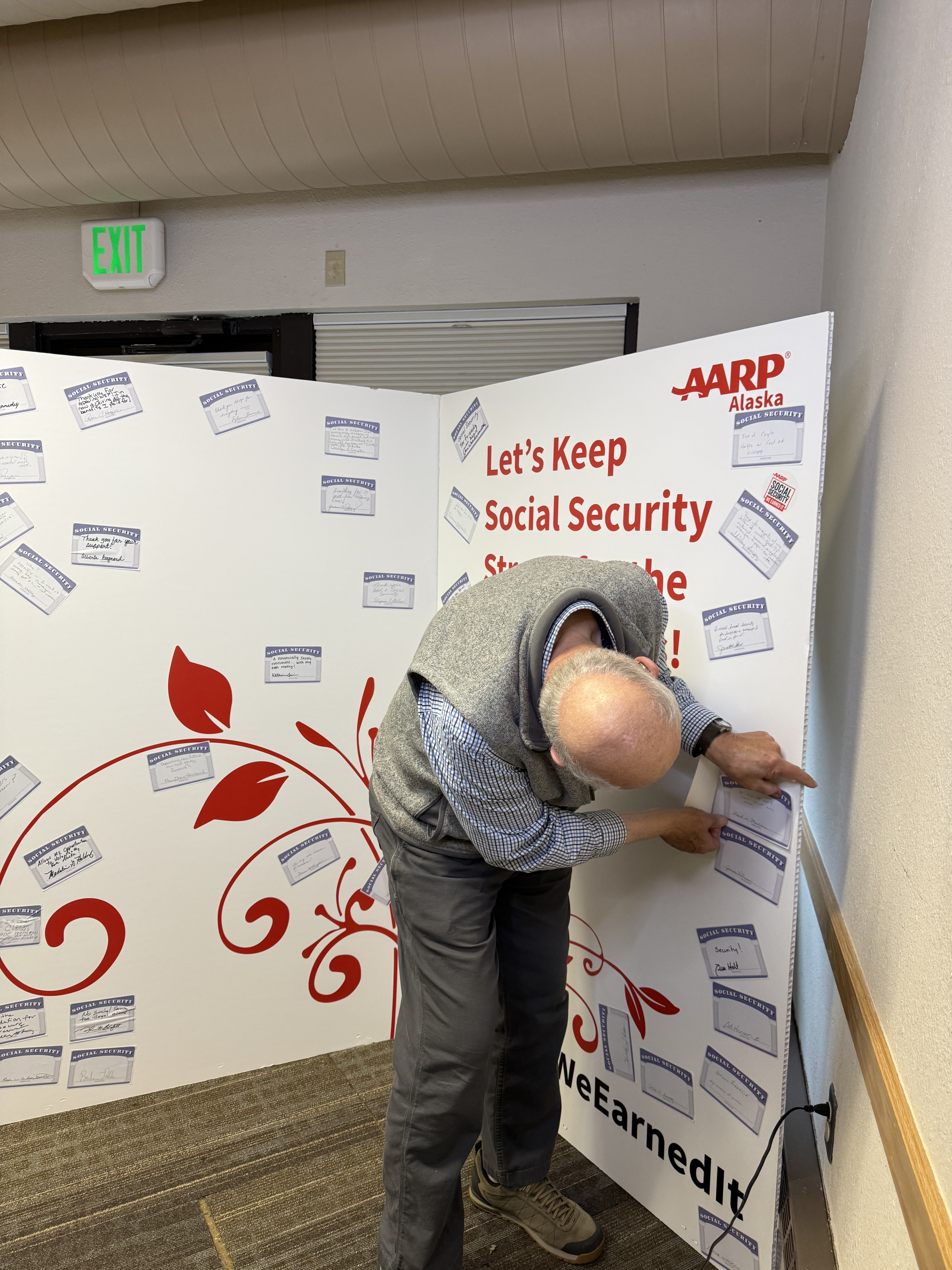 A Social Security party attendee adds his Social Security story to our 90th anniversary card.