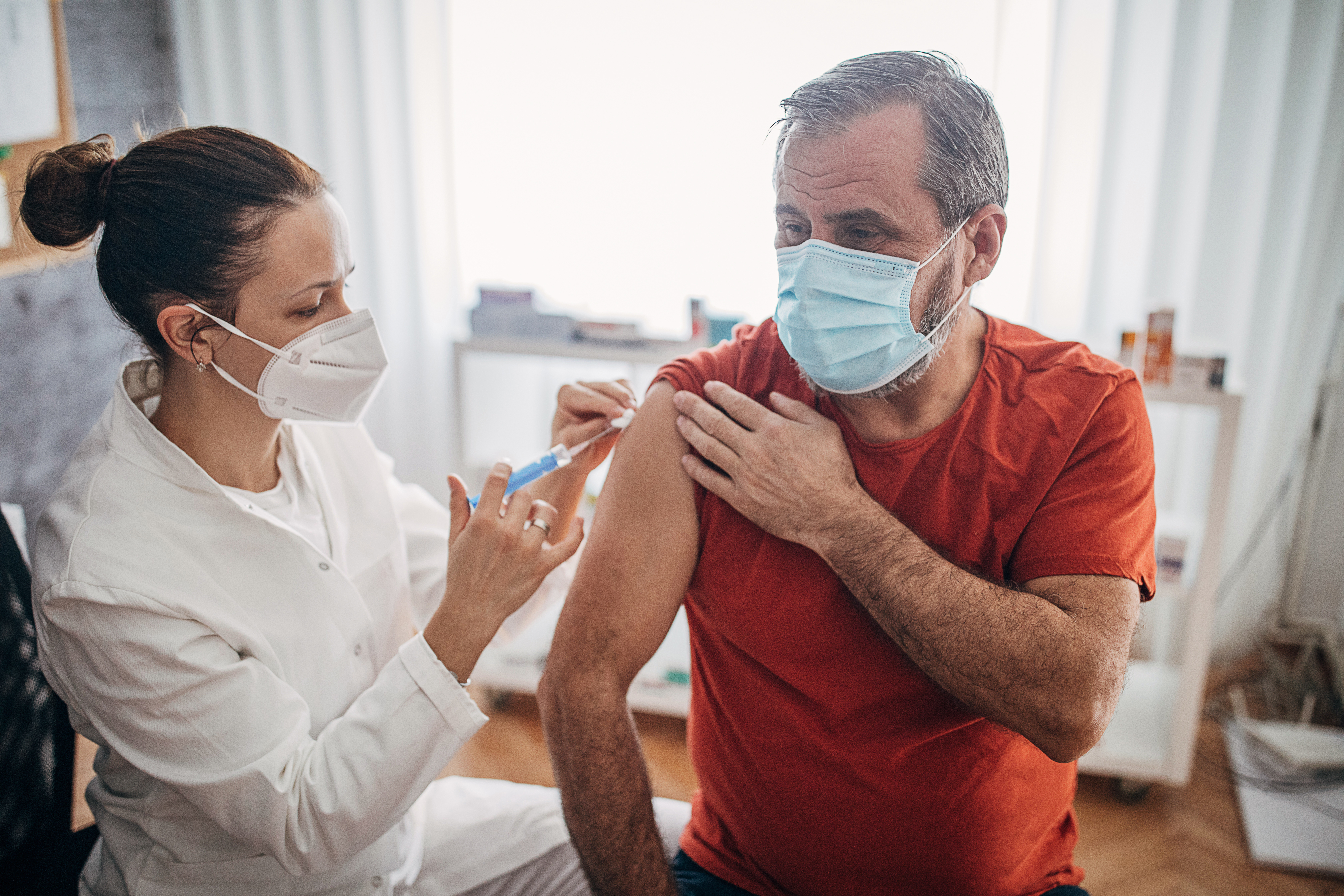 One man getting a coronavirus vaccine