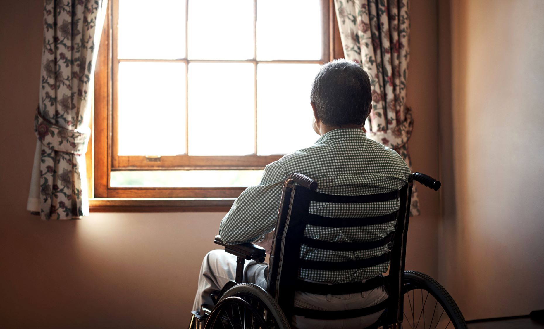 mid-sized image -- senior man wheelchair home GettyImages-648833770 (1).jpg