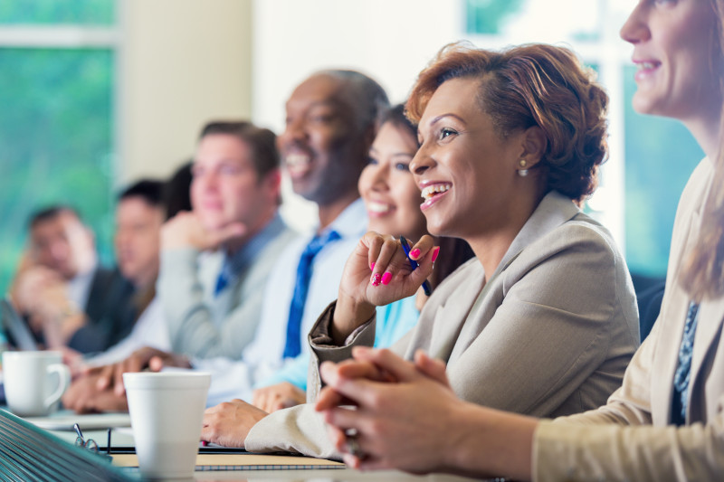 African American businesswoman attending seminar or job training business conference