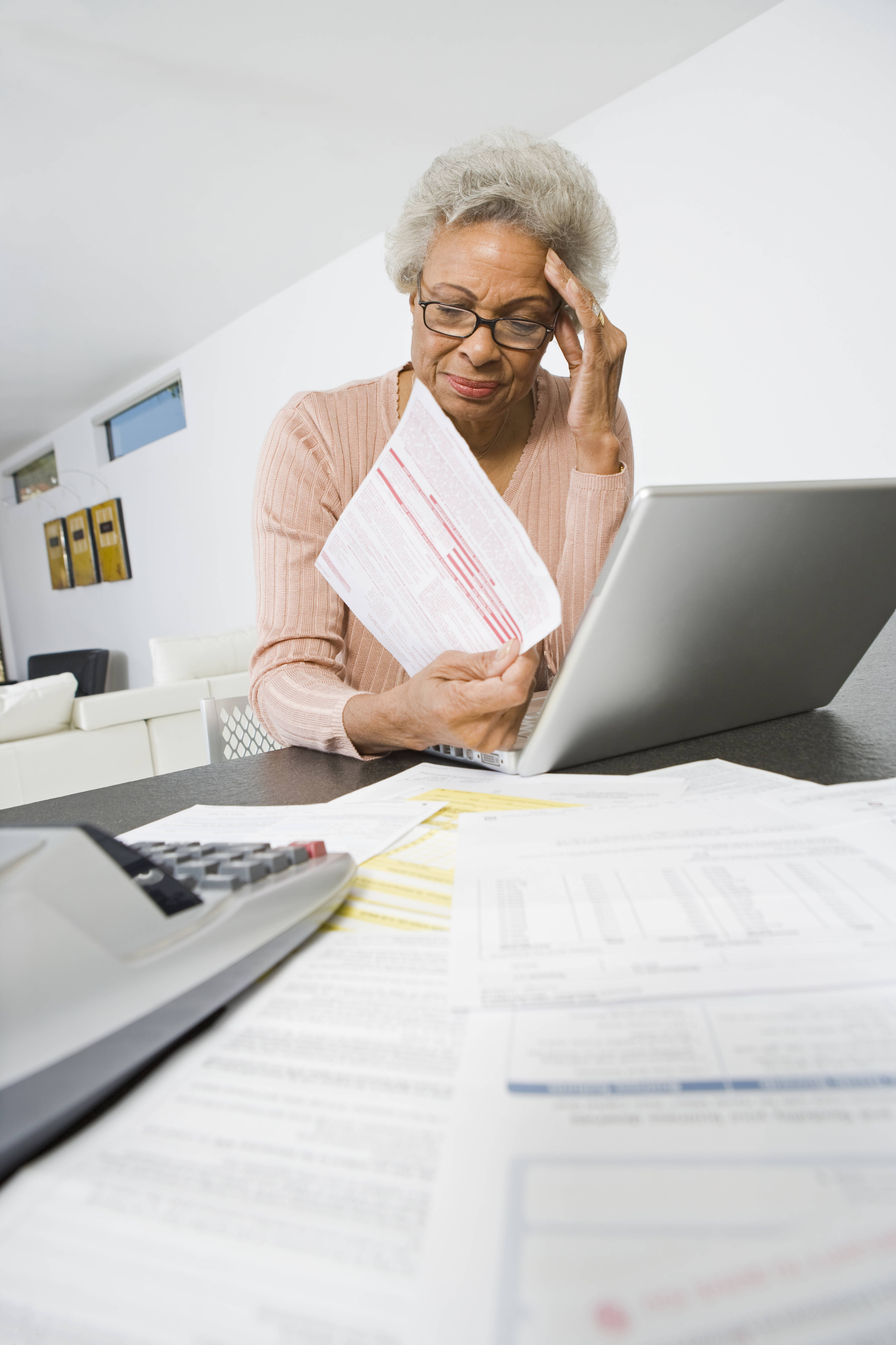 Senior Woman Worrying About Home Finances