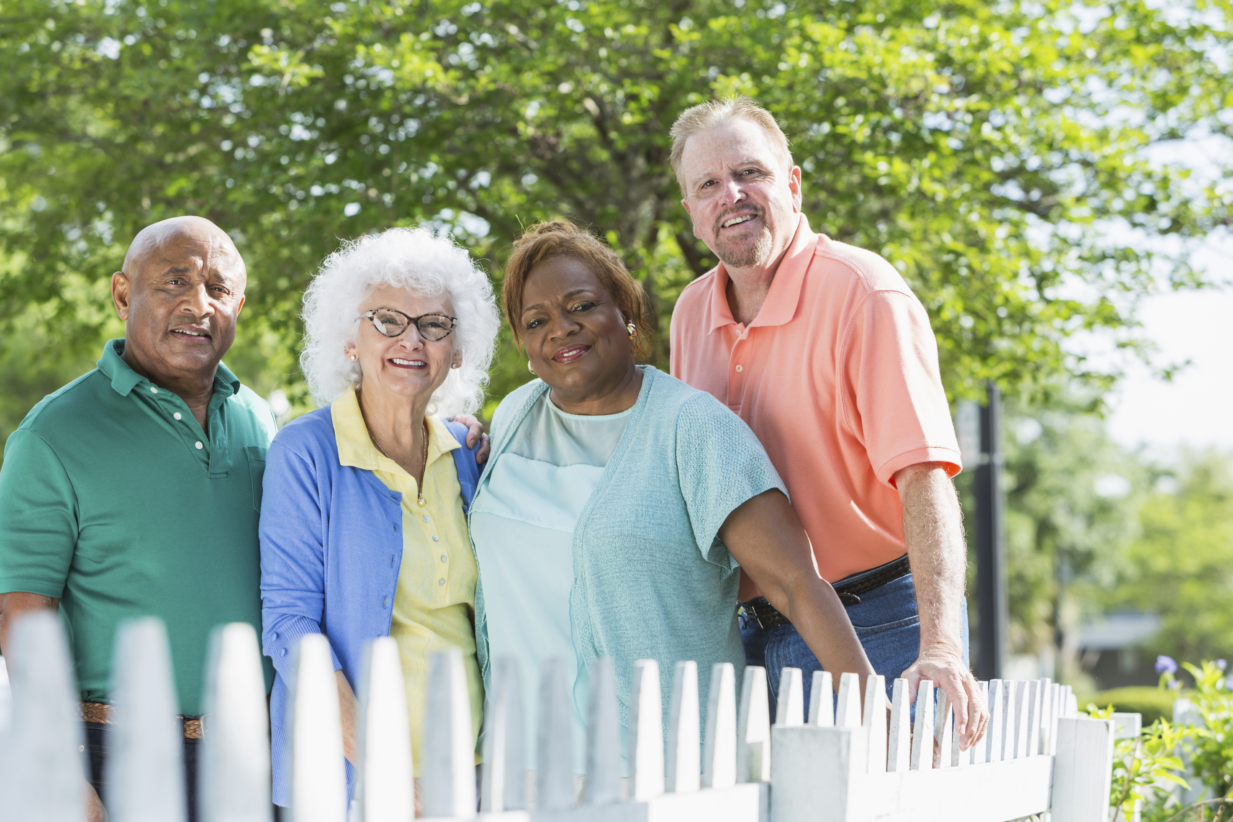 Multiracial group of seniors standing outdoors