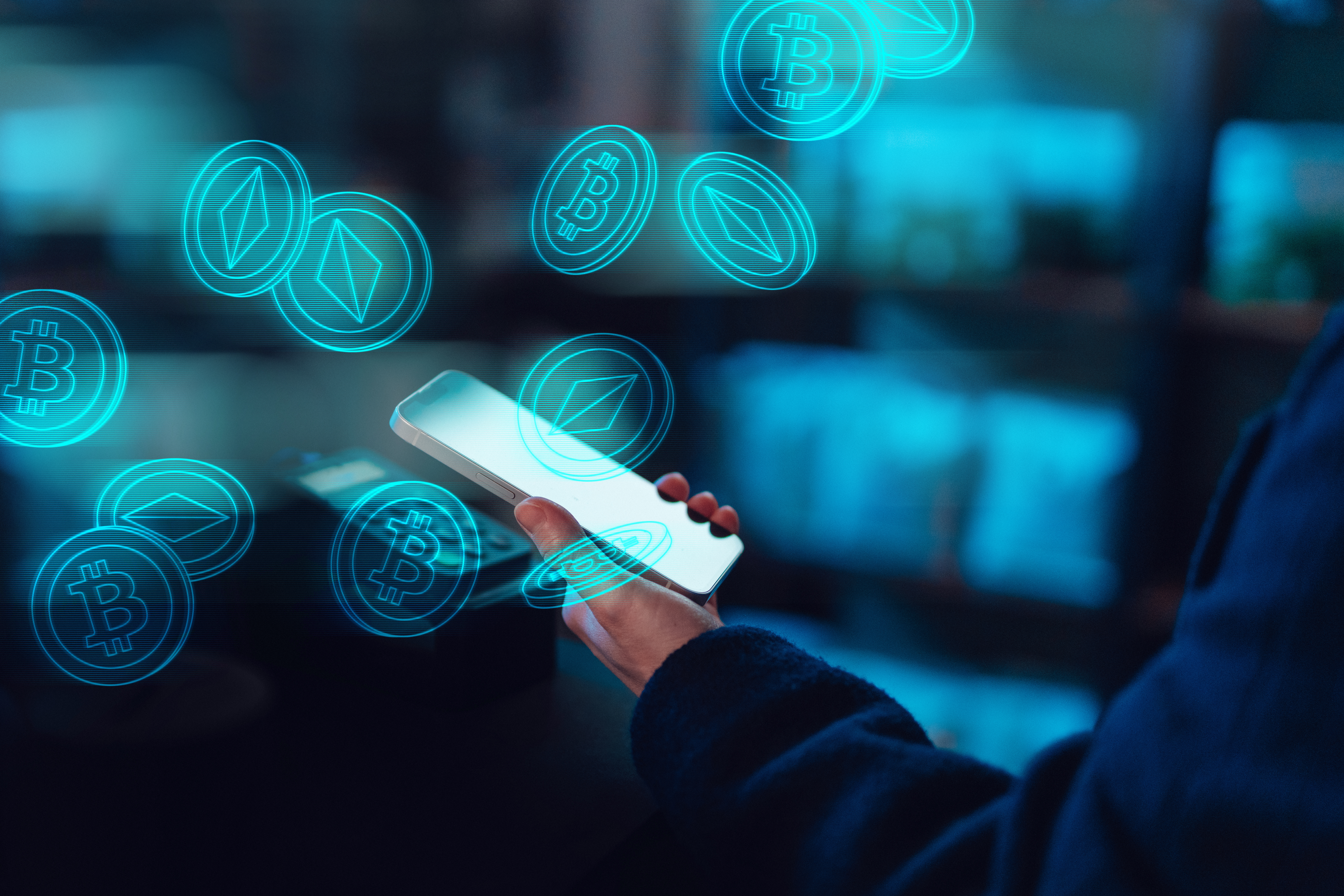 Close-up of female hand using mobile app, investing and trading digital currency on smartphone