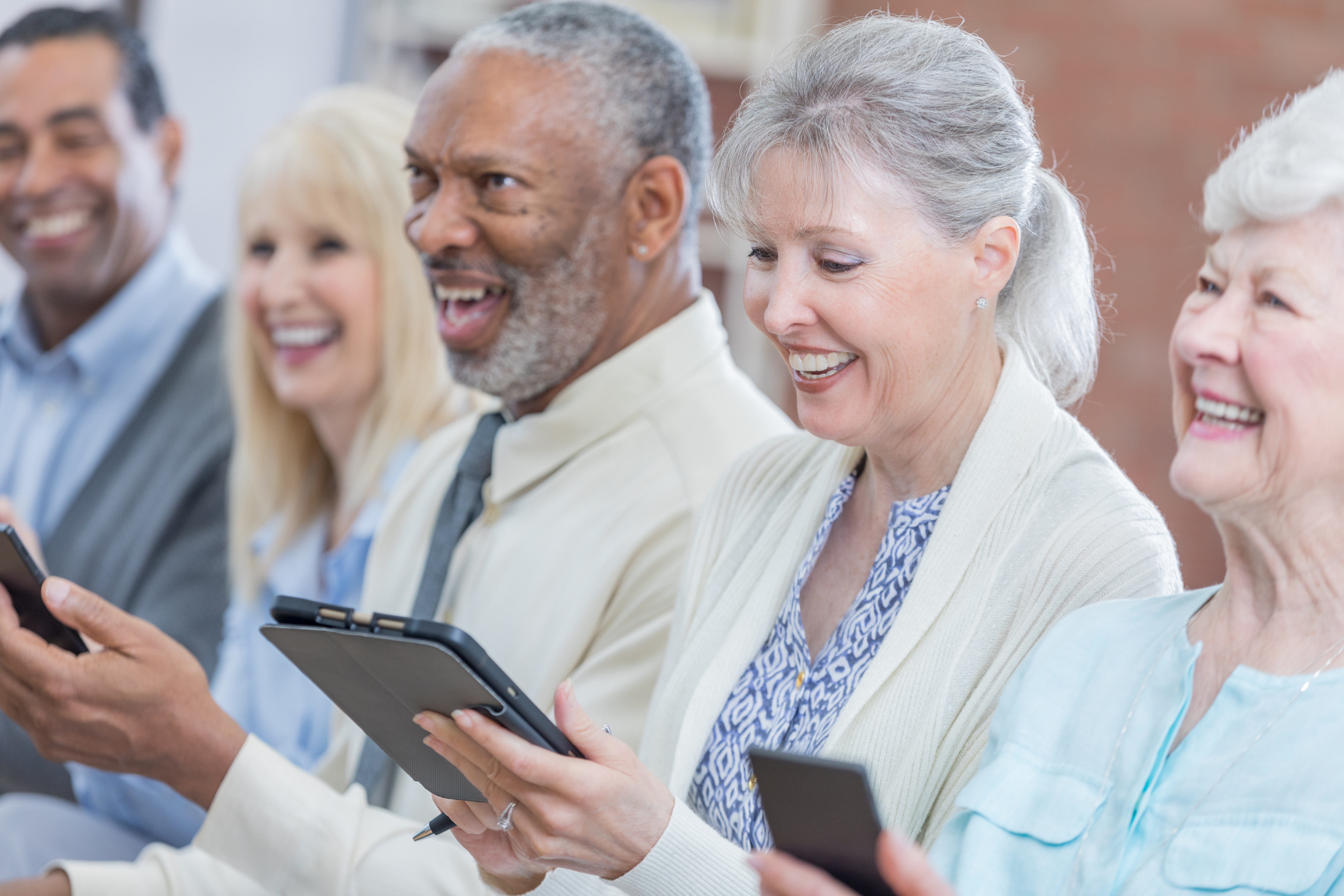 Senior adults use technology during conference