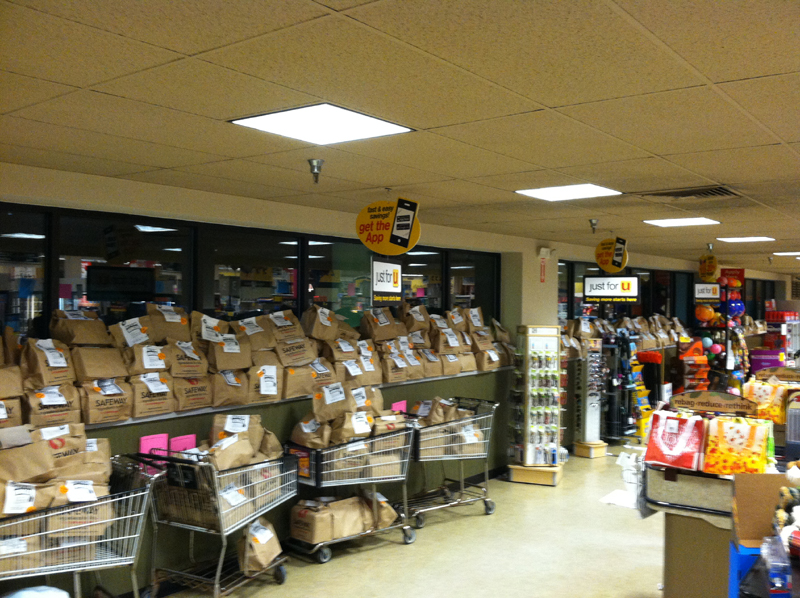 Donated grocery bags line the walls in a Safeway store in Jacksonville, MD