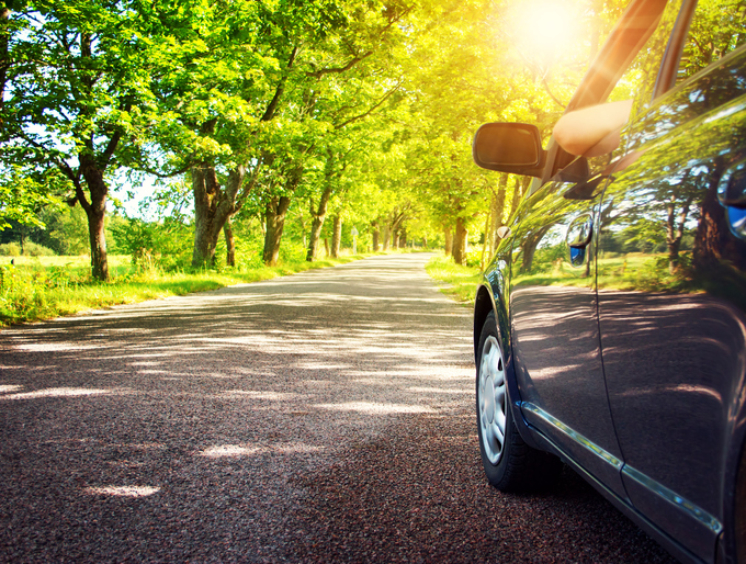 Car on asphalt road in summer