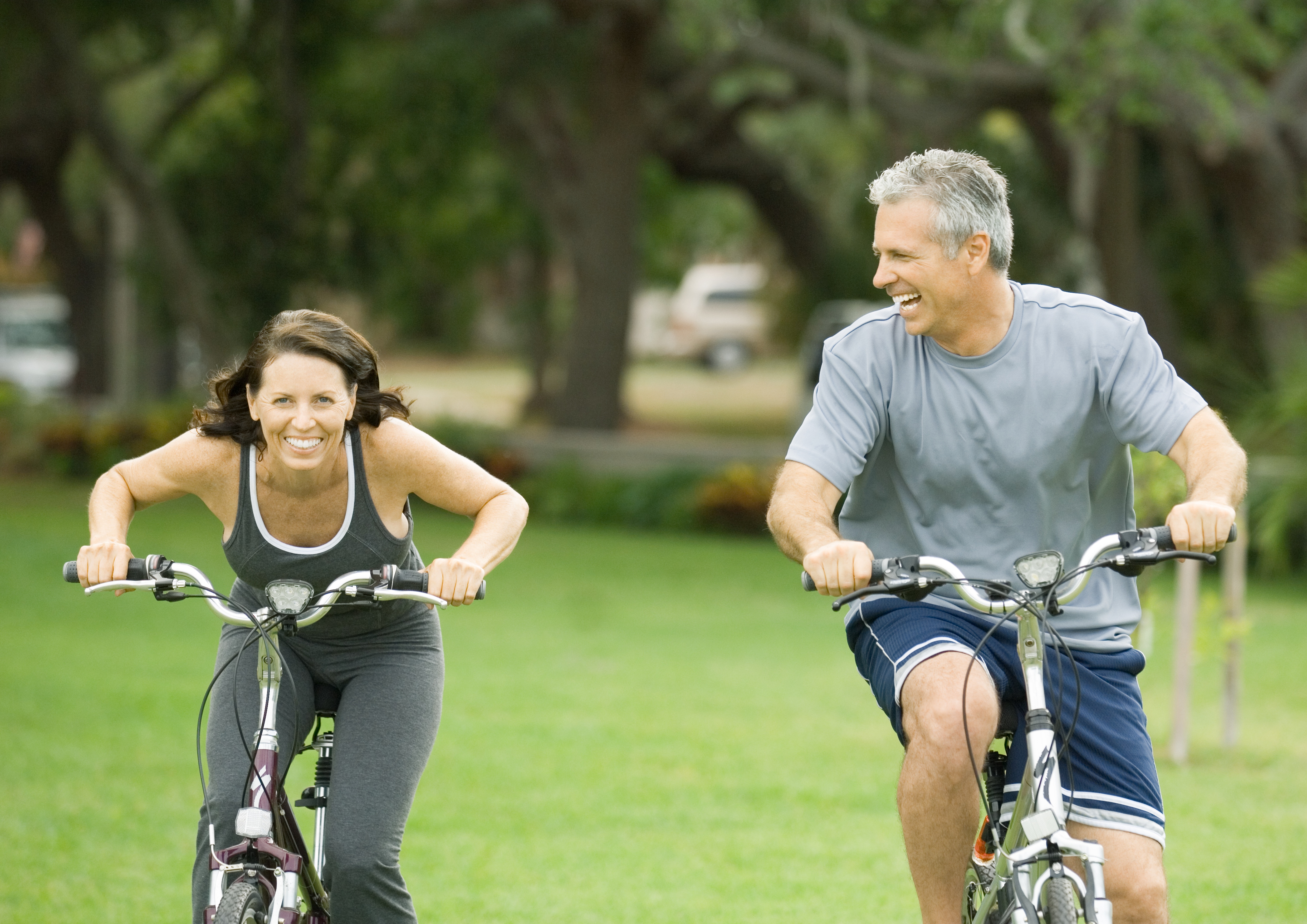 Mature couple riding bikes