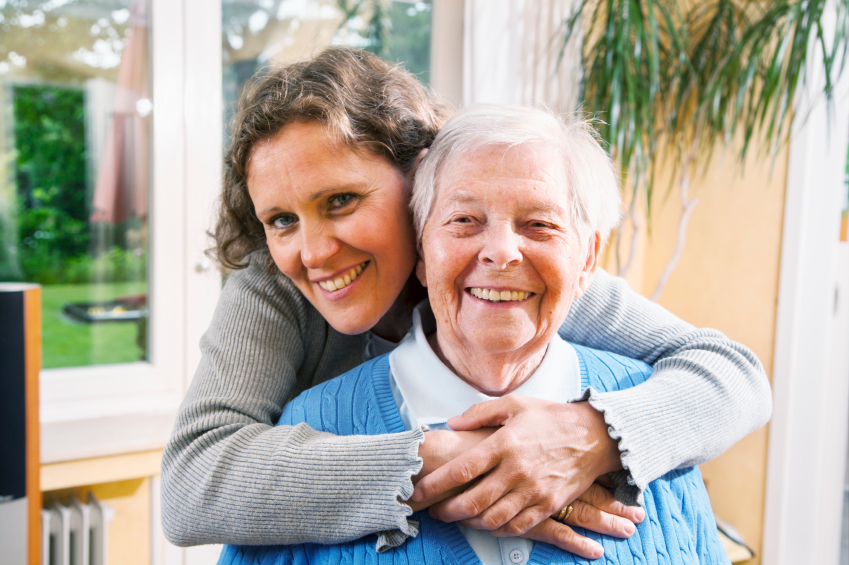 mature woman embracing senior woman