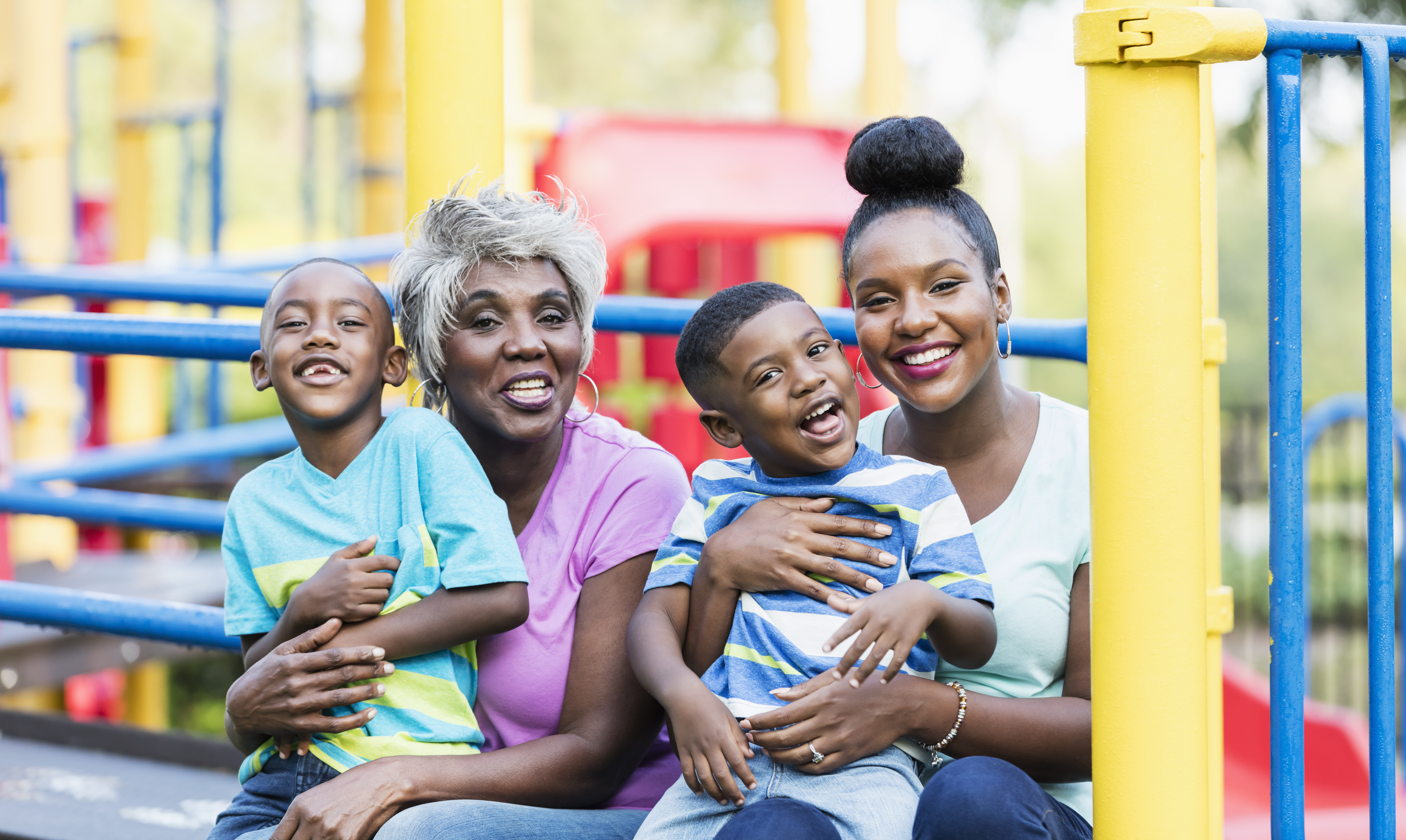 African-American family having fun at a playground.