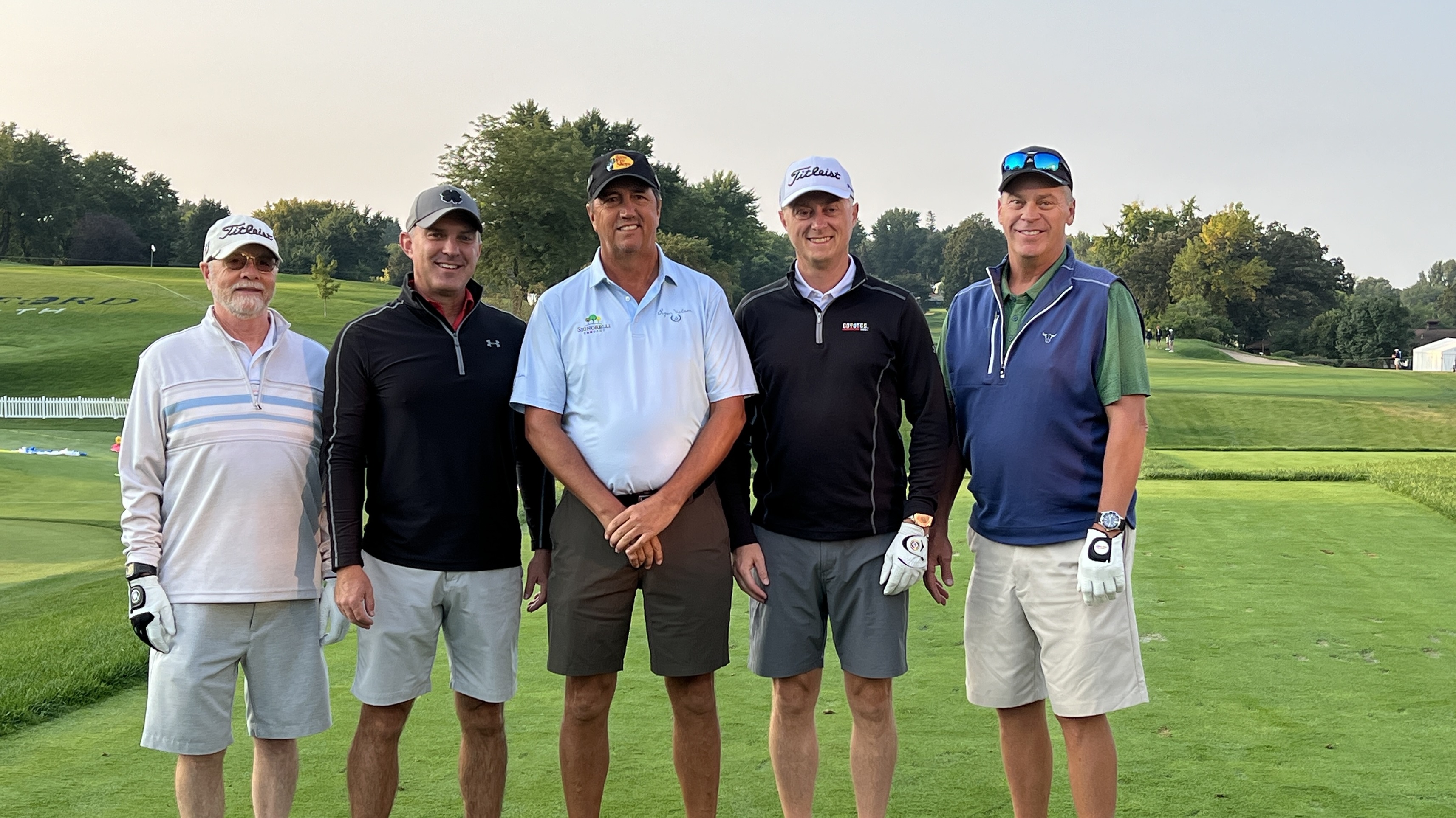 A group of five male golfers standing on a tee box at Minnehaha Country Club in Sioux Falls.