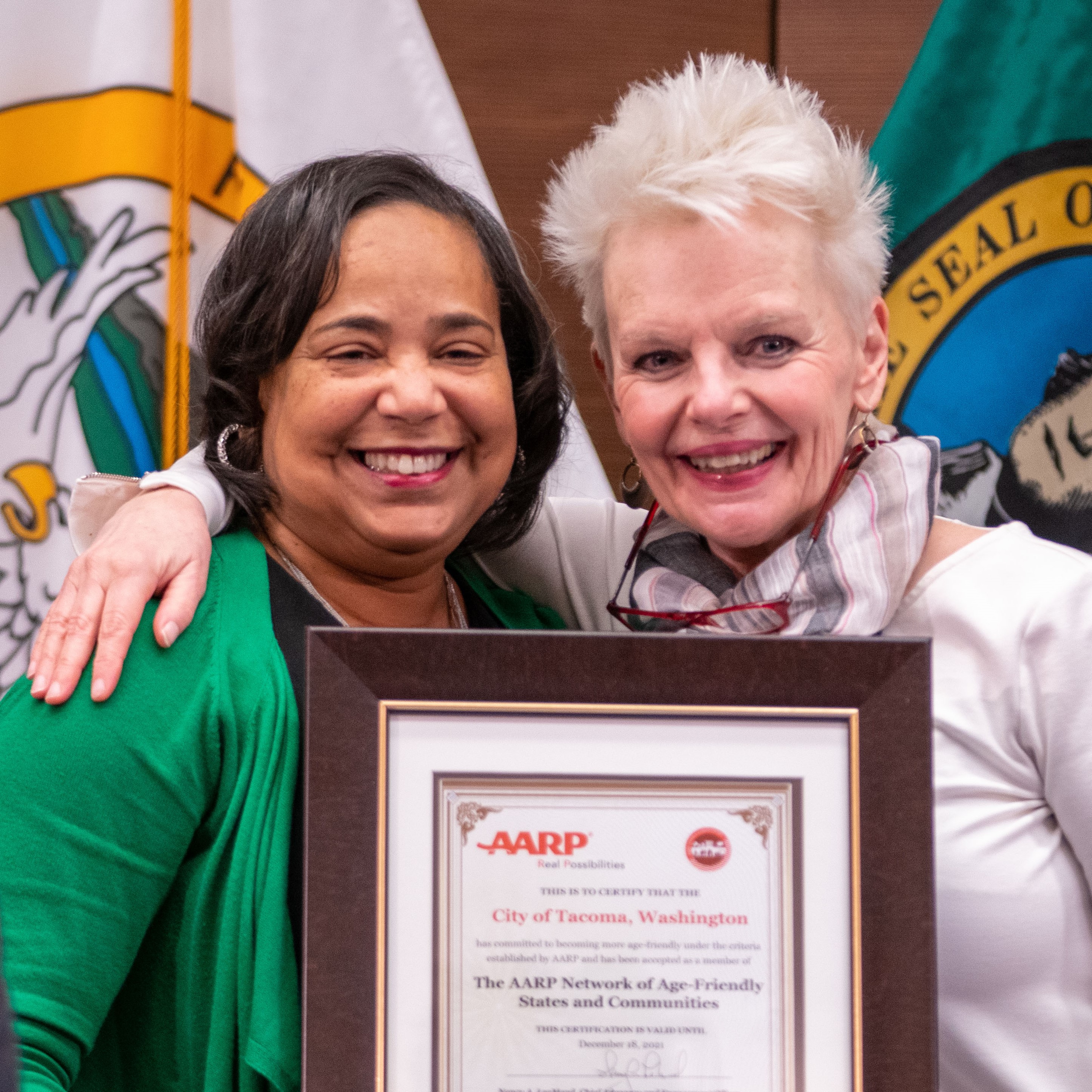 Tacoma Mayor Victoria Woodards and At-Large Council Member Lillian Hunter with age-friendly designation certificate.
