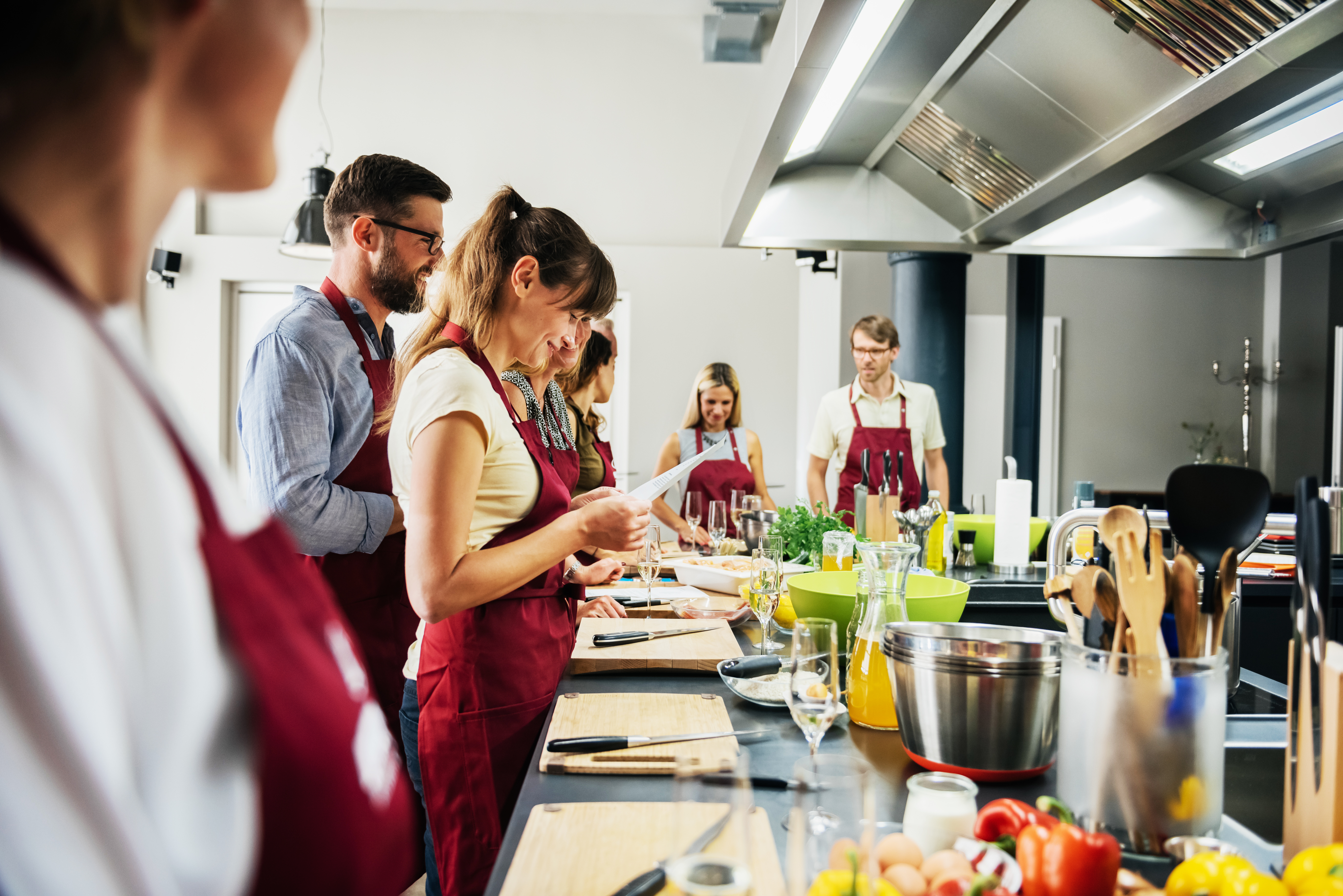 Woman studying recipe in cooking class