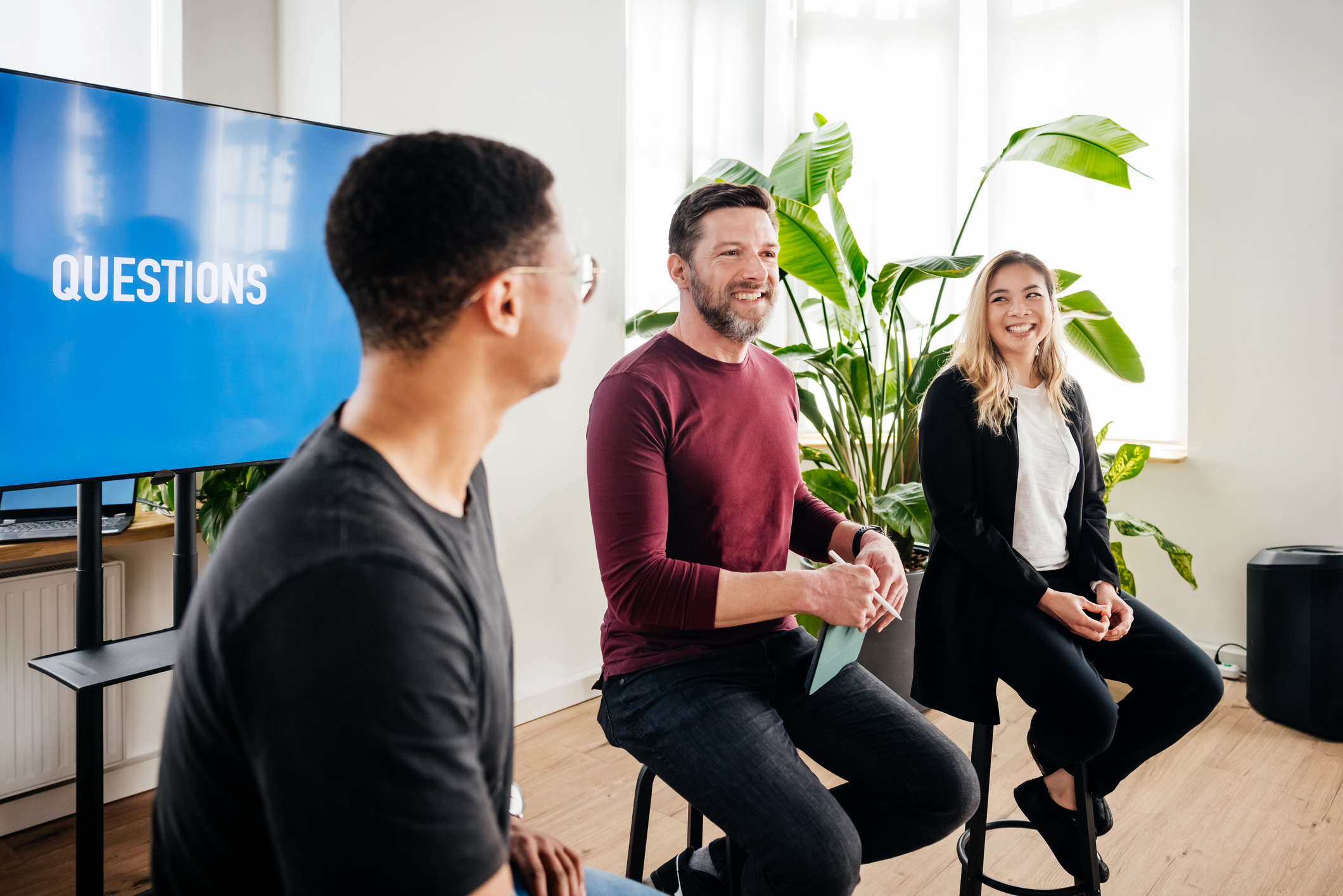 Three Speakers Interacting While Holding Seminar