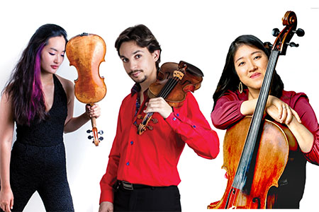 Three musicians, two women and one man, with string instruments looking at the camera.