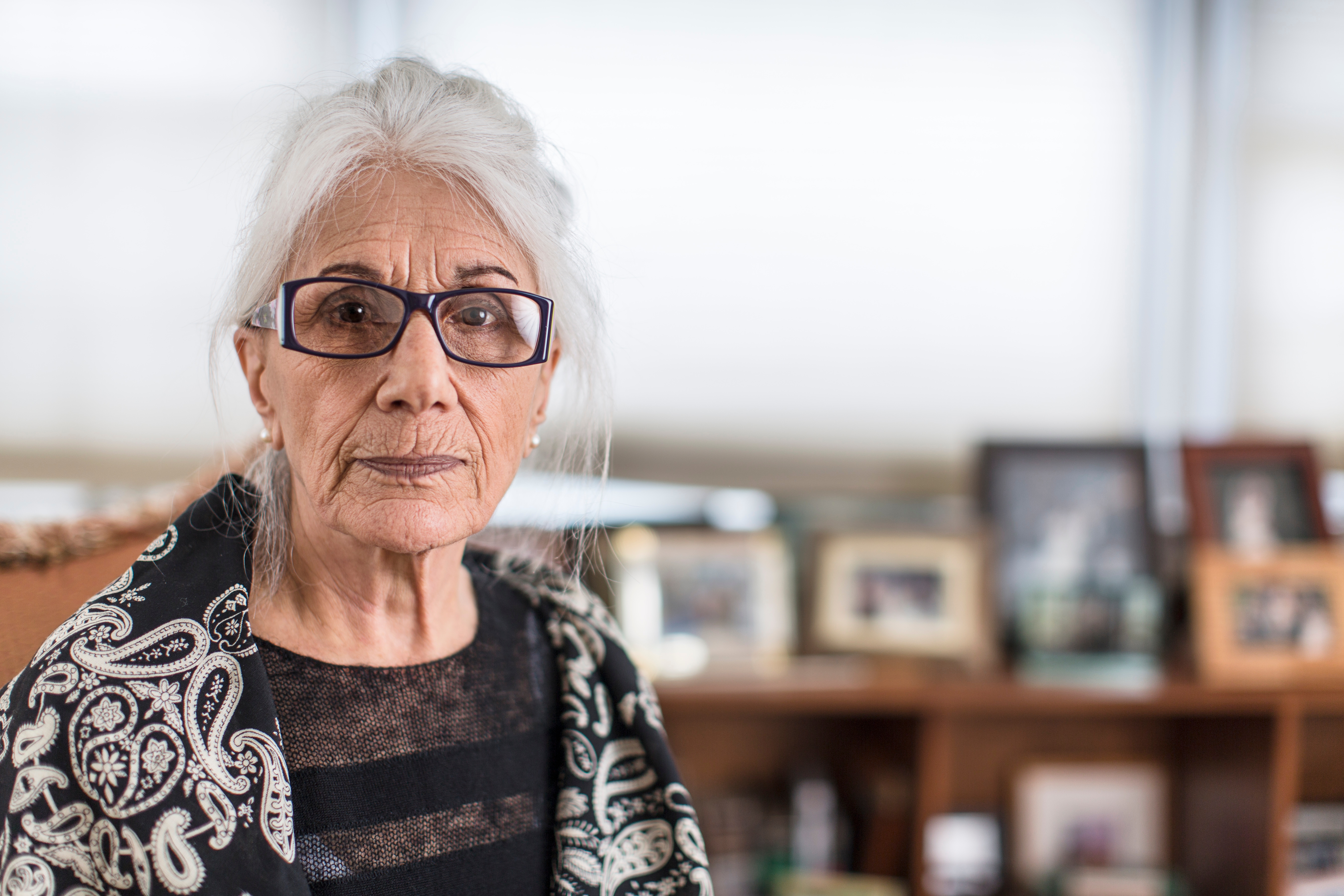 Portrait of senior woman wearing eyeglasses at home