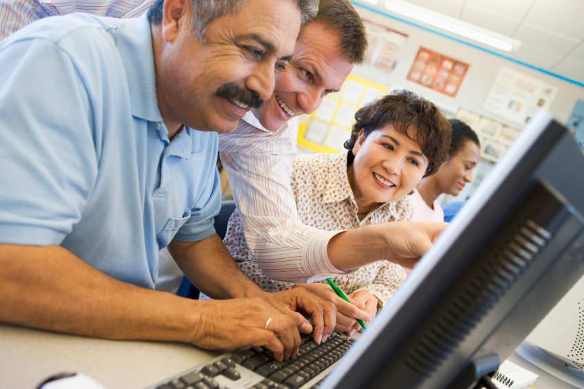 Mature students learning computer skills