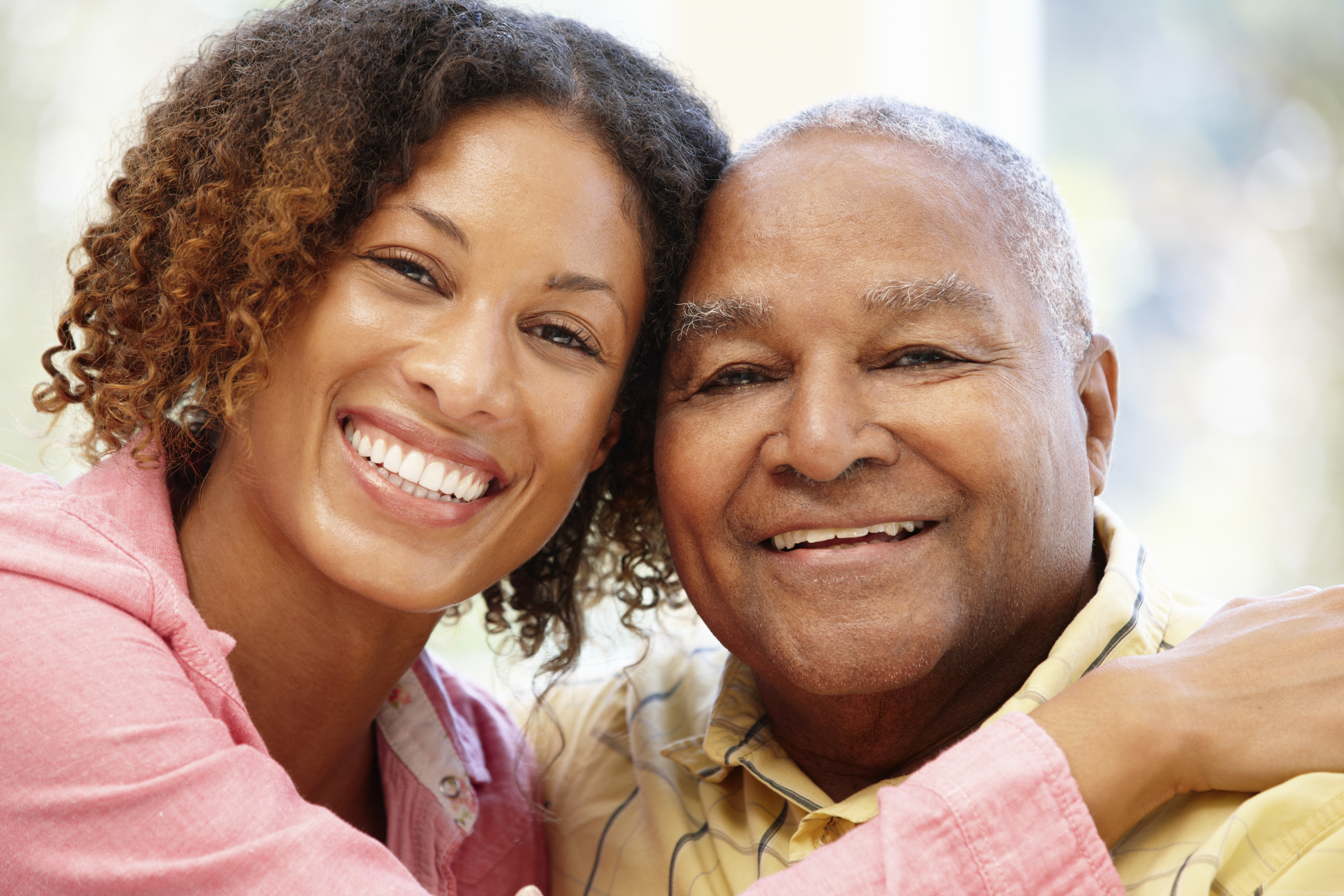 Senior African American man and granddaughter